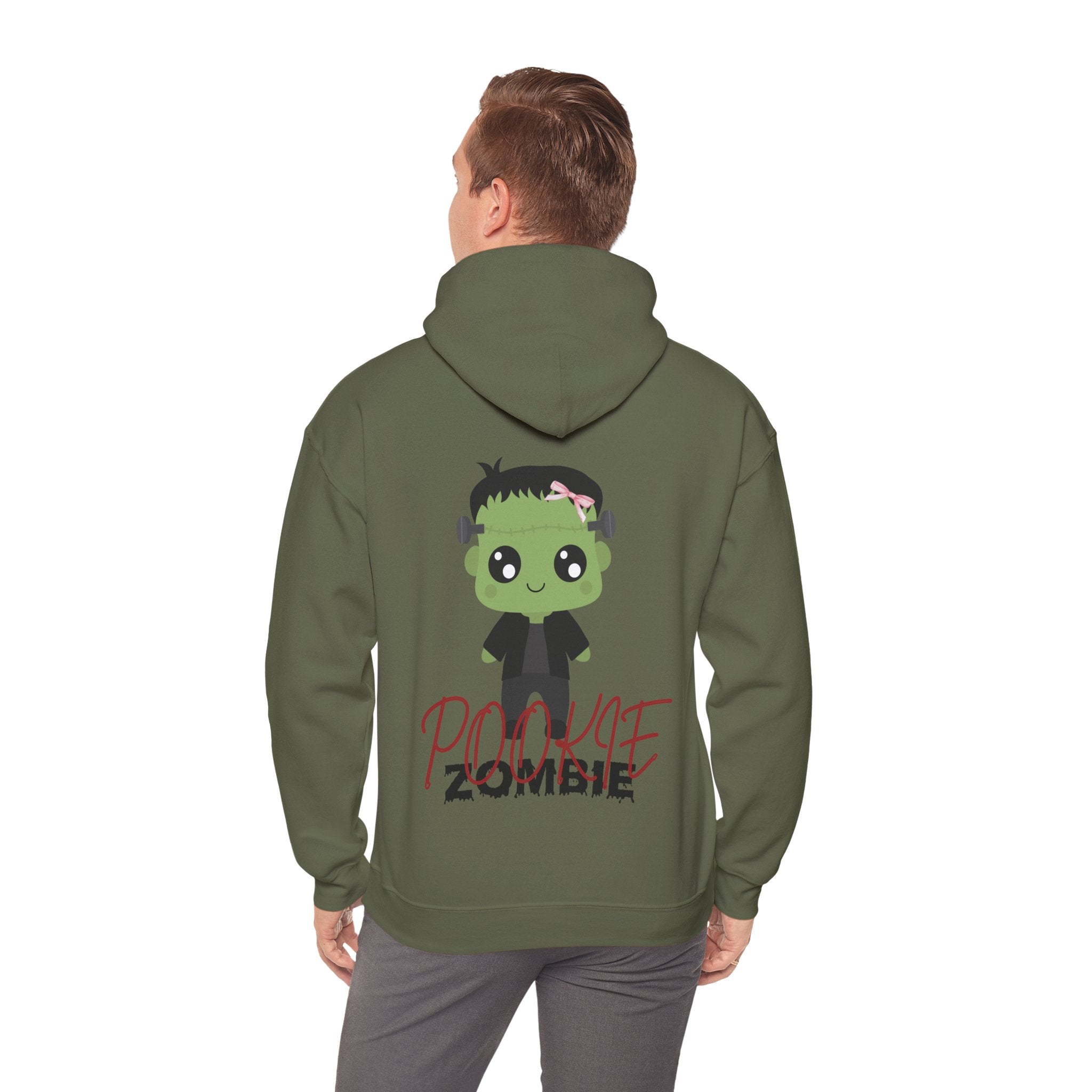 Person wearing a Military green hoodie with a cartoon zombie design on the back