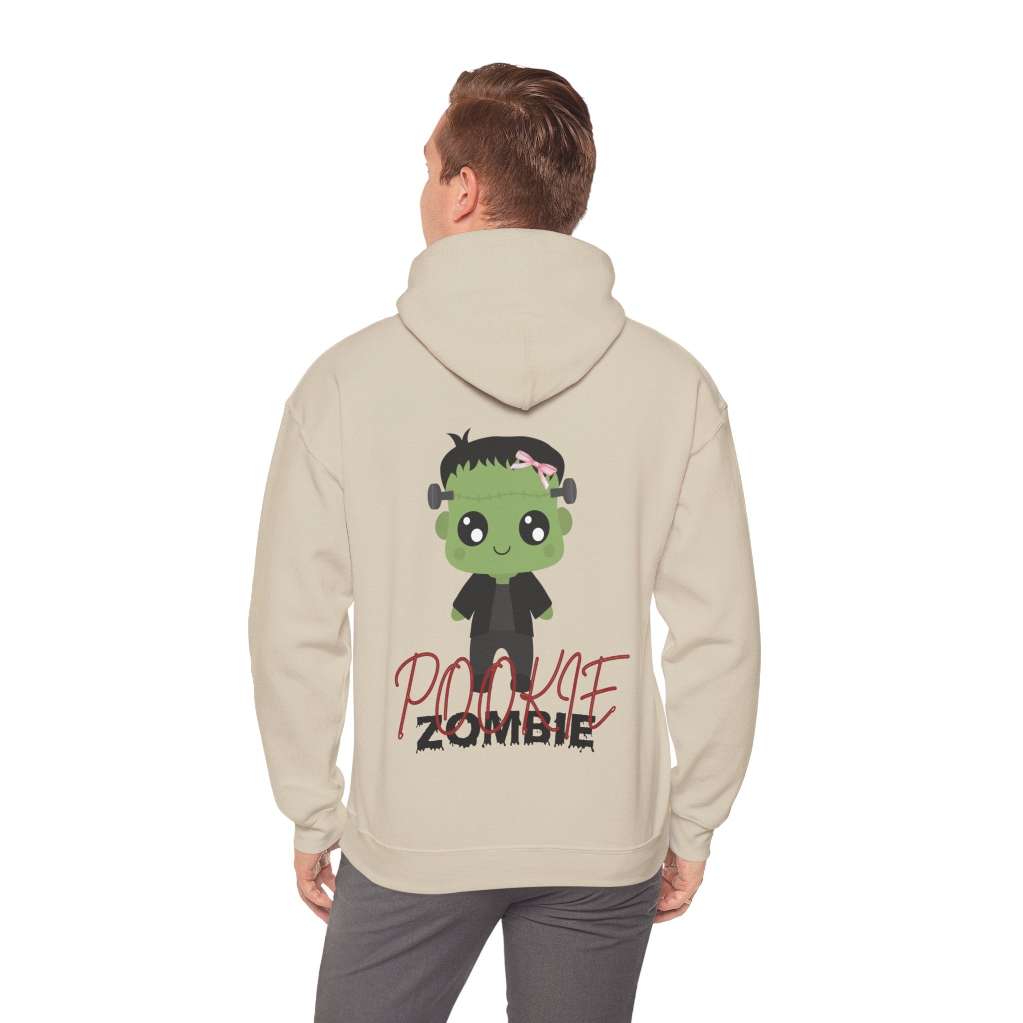 Person wearing a Sand hoodie with a cartoon zombie design on the back, on a white background