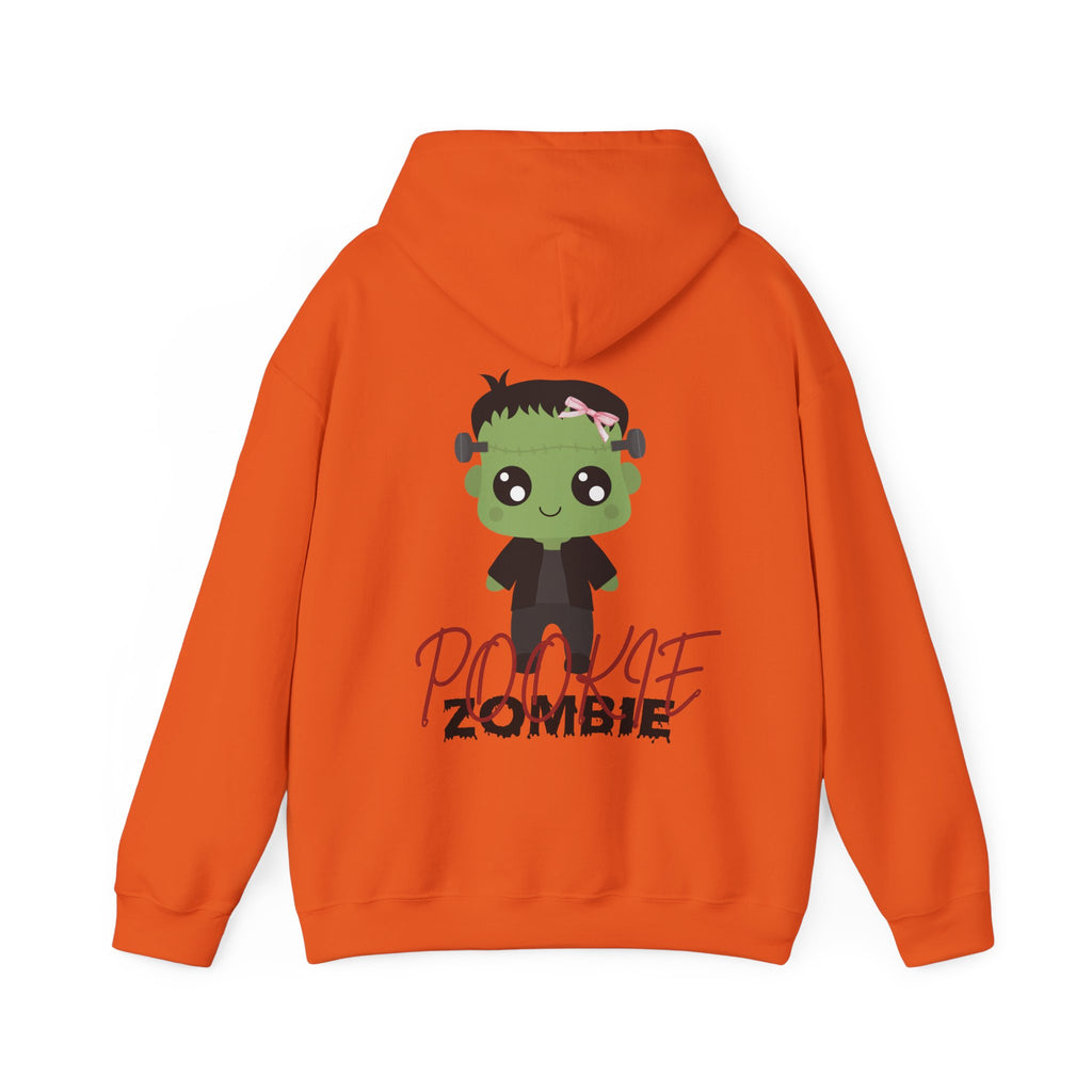 Orange hoodie with a cartoon zombie design on the back against a white background