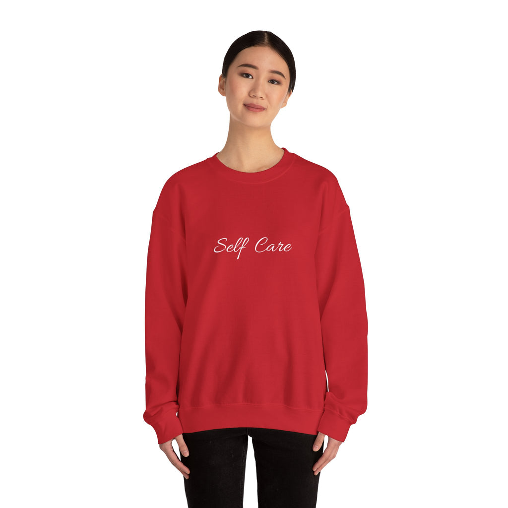 Person wearing a red sweatshirt with 'Self Care' text on a white background