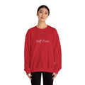 Person wearing a red sweatshirt with 'Self Care' text on a white background