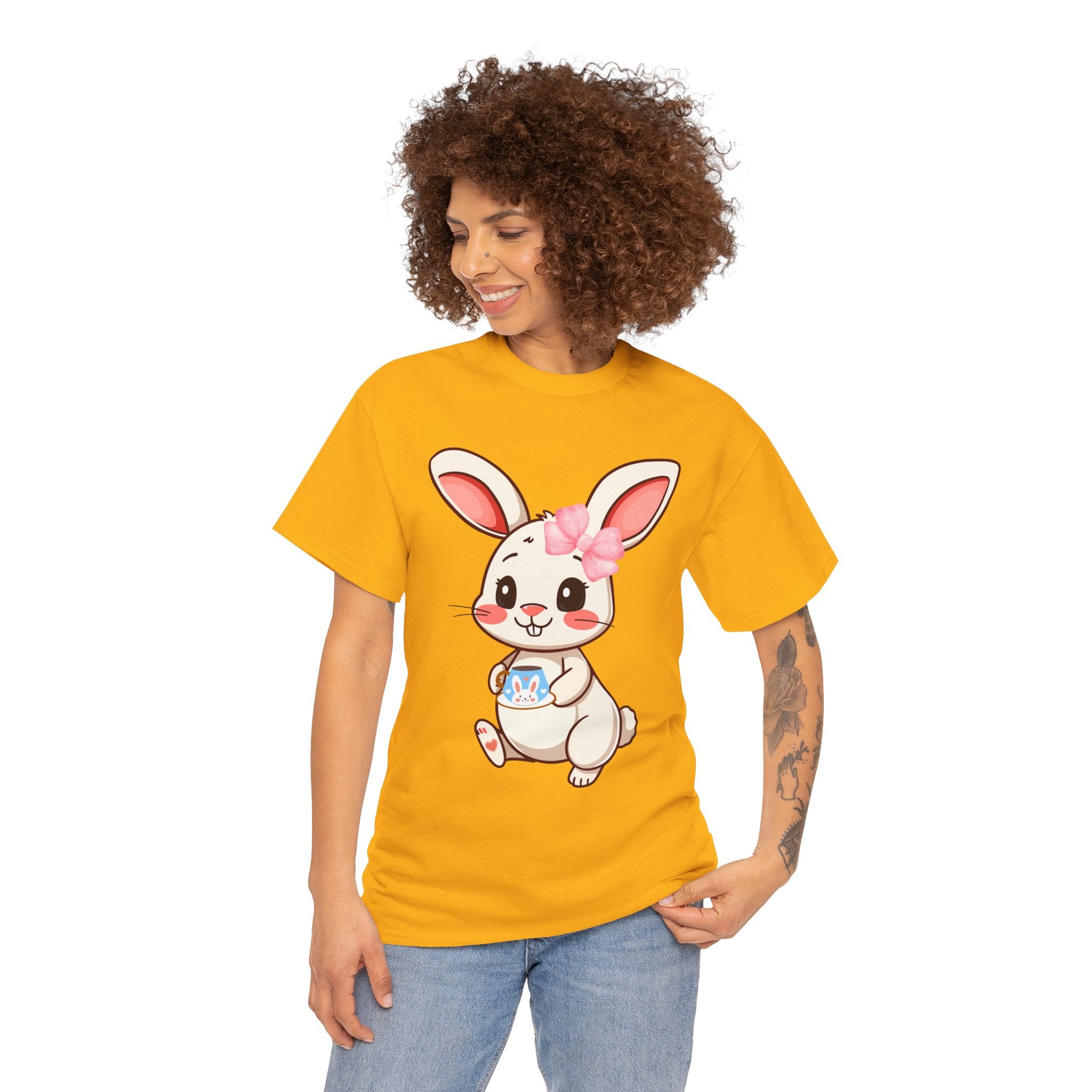 Person wearing a Gold t-shirt with a cartoon bunny design on a white background