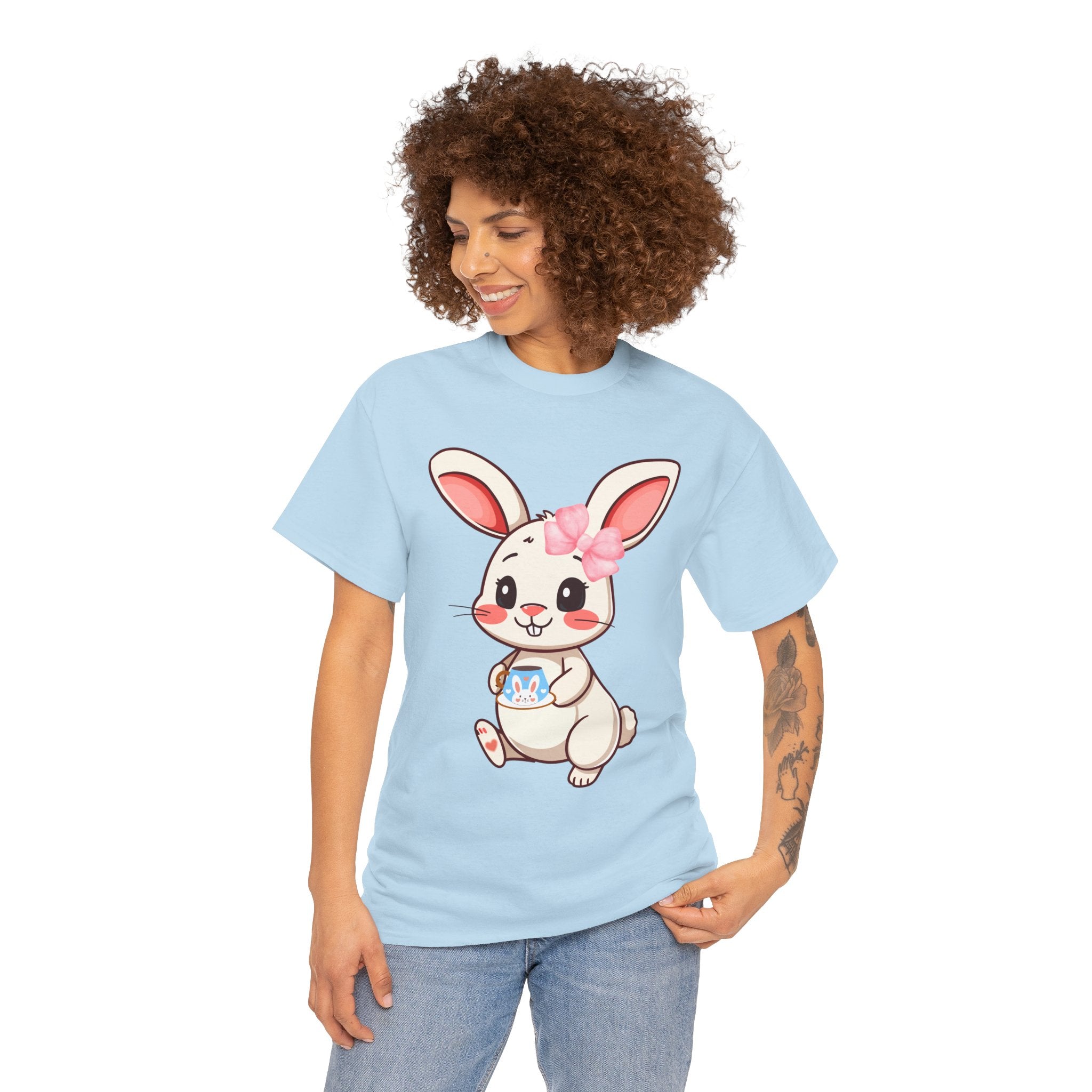 Person wearing a light blue t-shirt with a cartoon bunny design on a white background