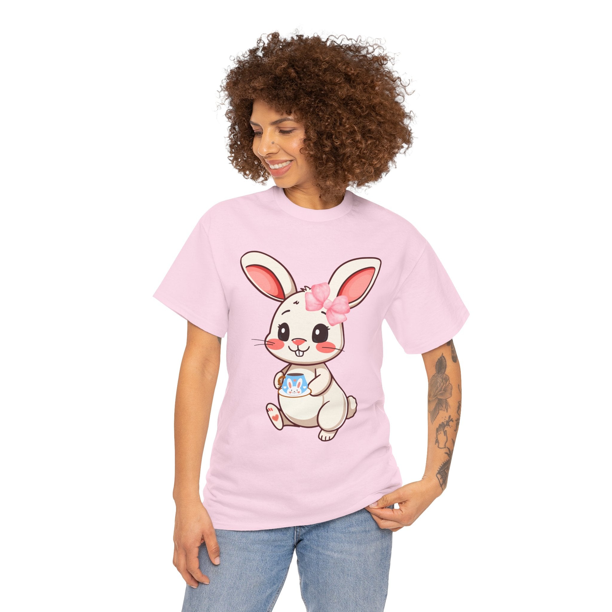 Person wearing a Light pink t-shirt with a cartoon bunny design on a white background