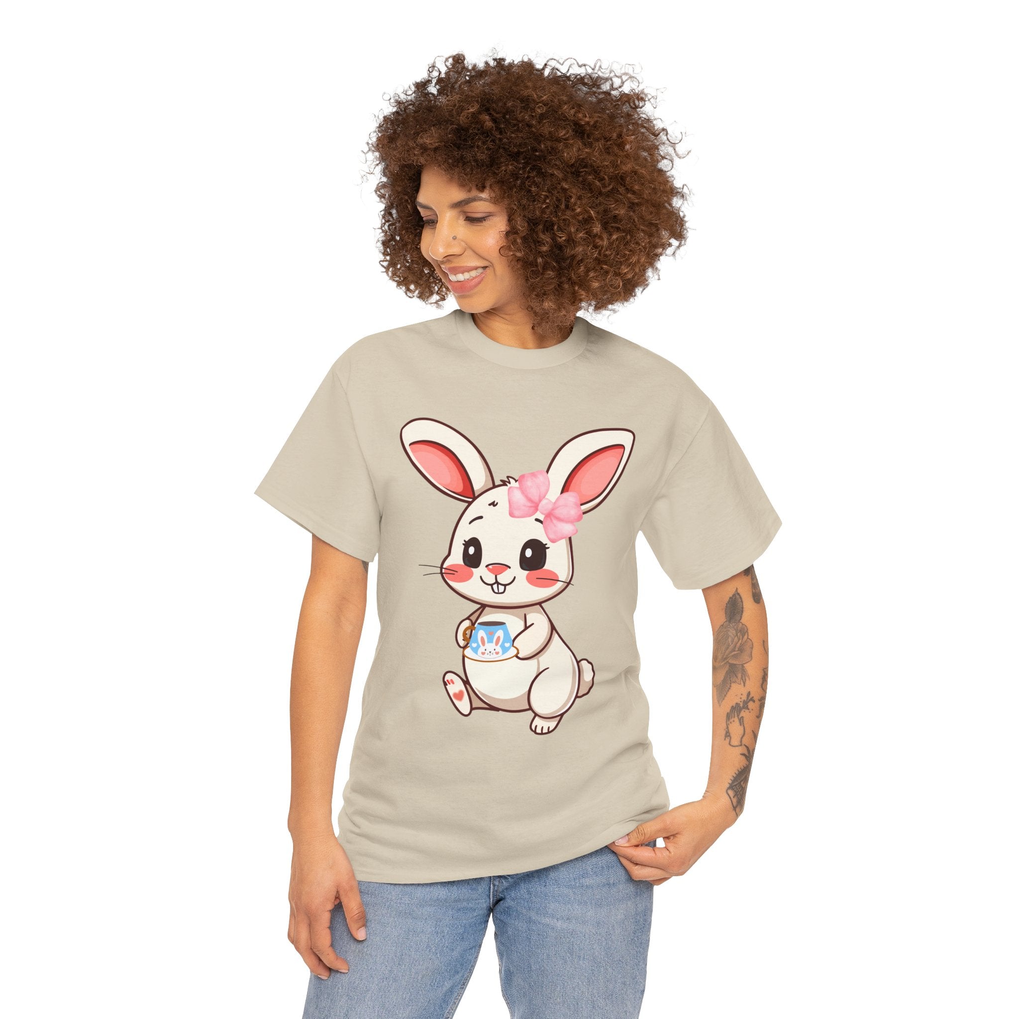 Woman wearing a Sand t-shirt with a cartoon bunny design on a white background