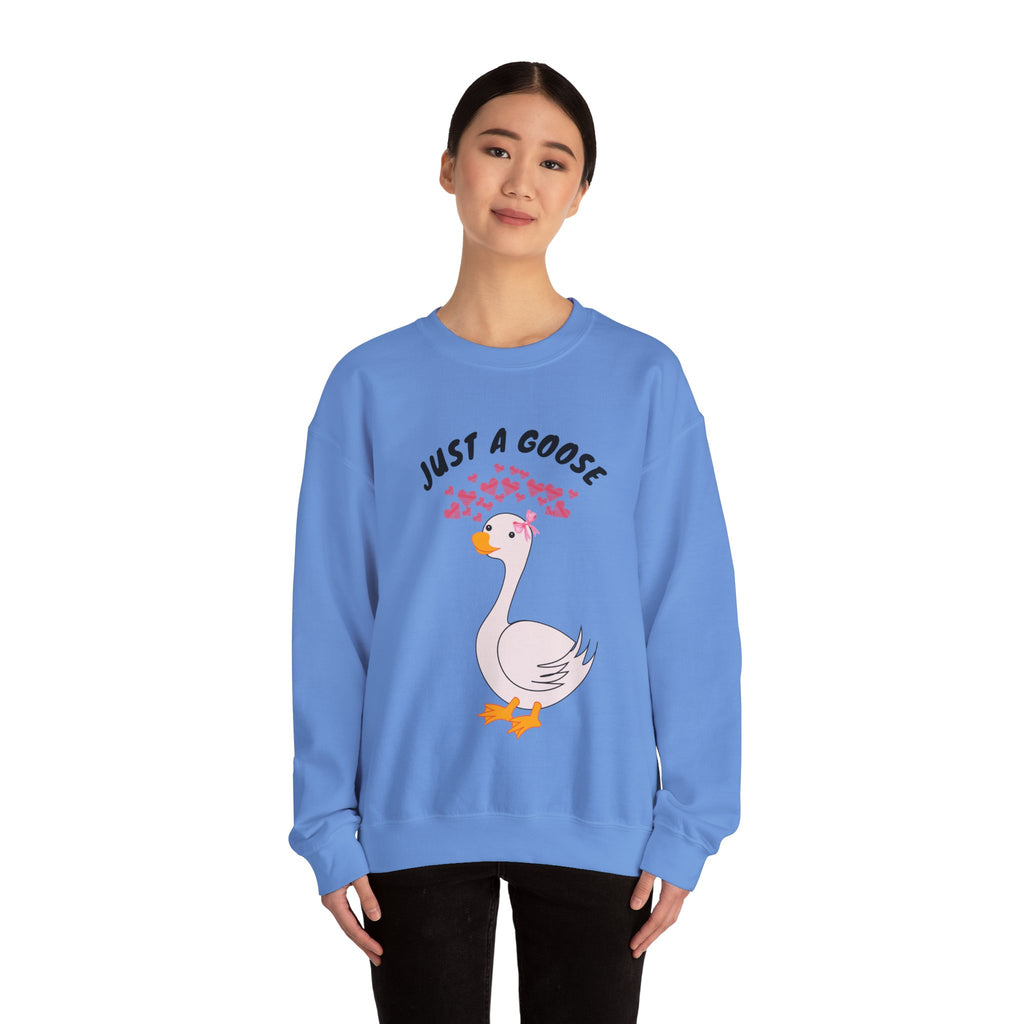 Person wearing a Carolina blue sweatshirt with a goose graphic and text on a white background