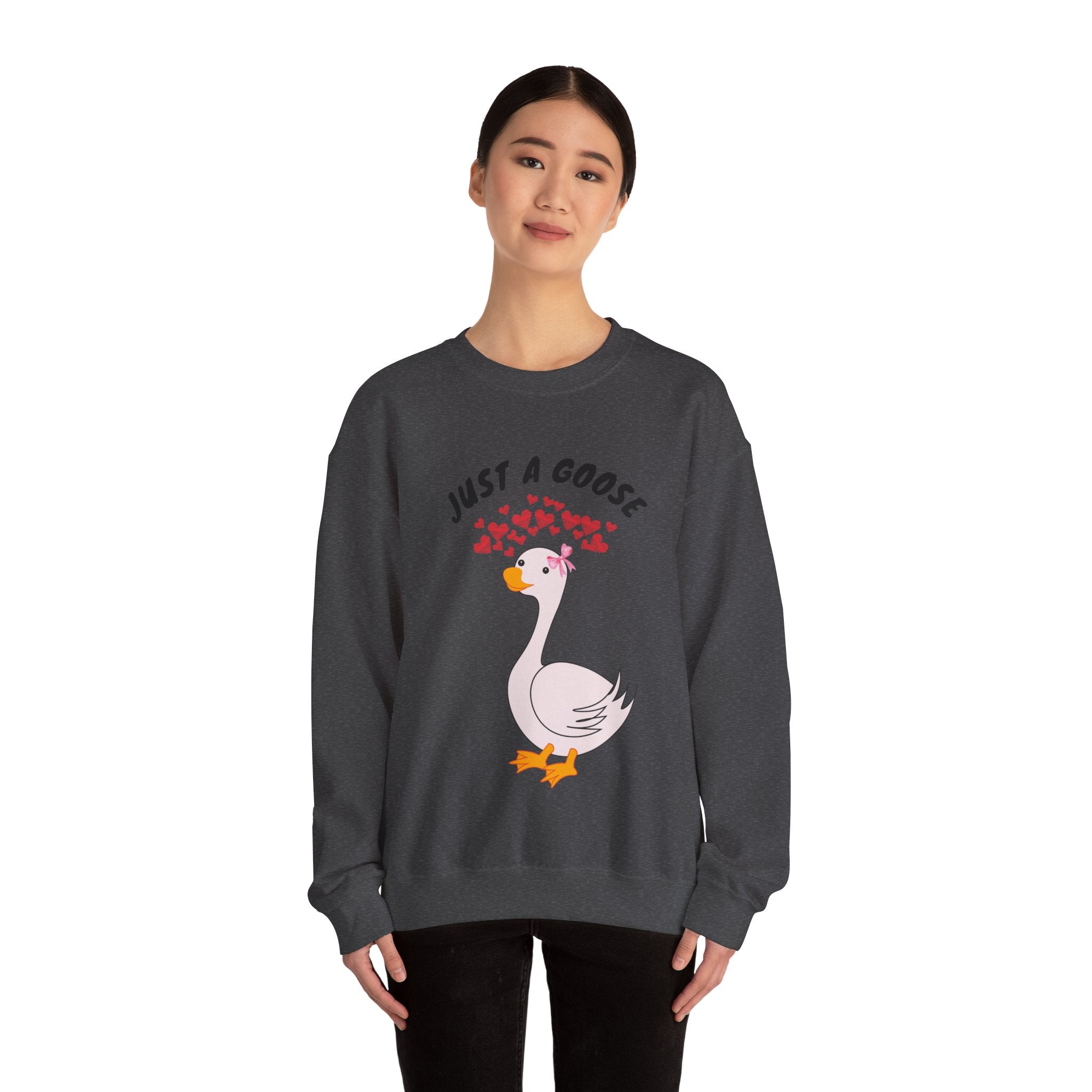 Person wearing a dark Heather sweatshirt with a goose graphic and text on a white background