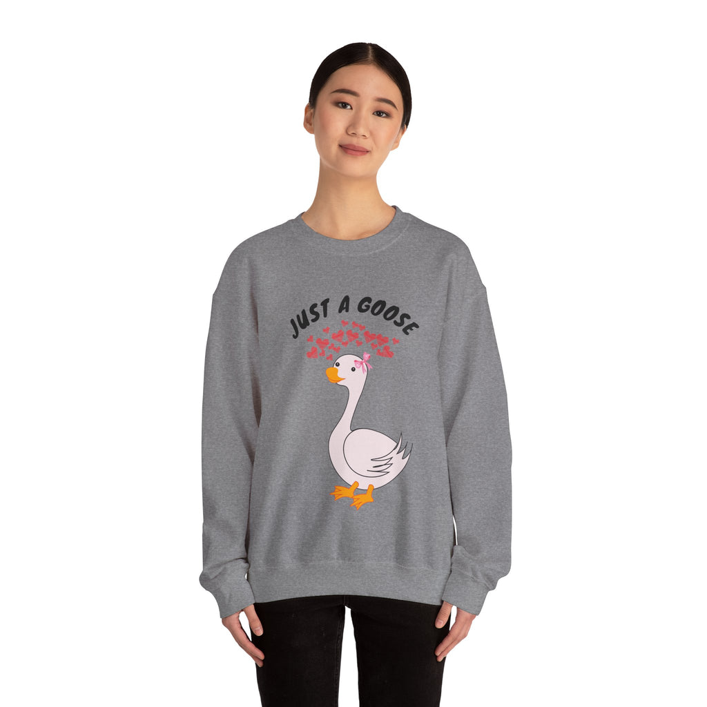Person wearing a graphite Heather sweatshirt with a goose graphic and text on a white background