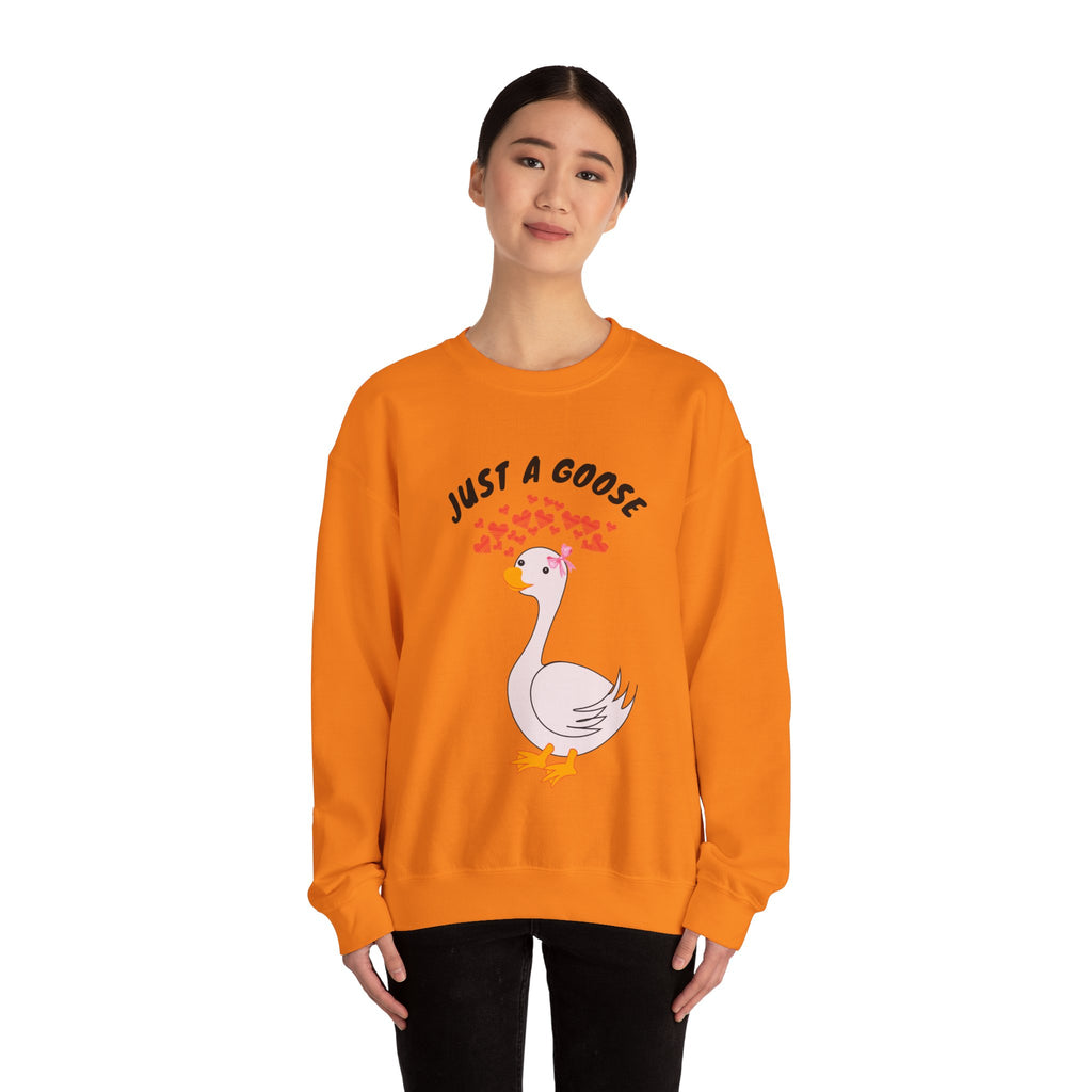 Person wearing a Safety orange sweatshirt with a goose graphic and text on a white background