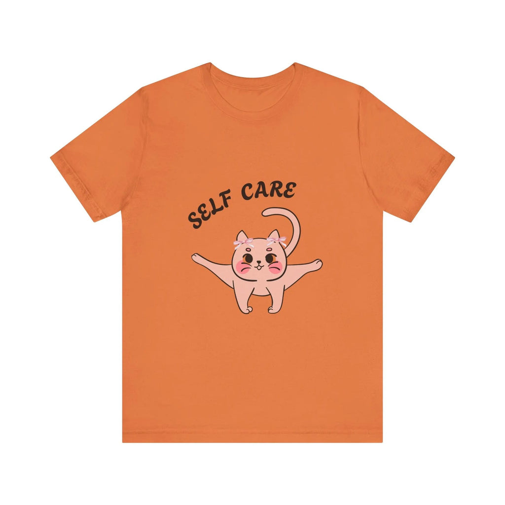 Burnt Orange t-shirt with a cartoon cat and 'SELF CARE' text on a white background