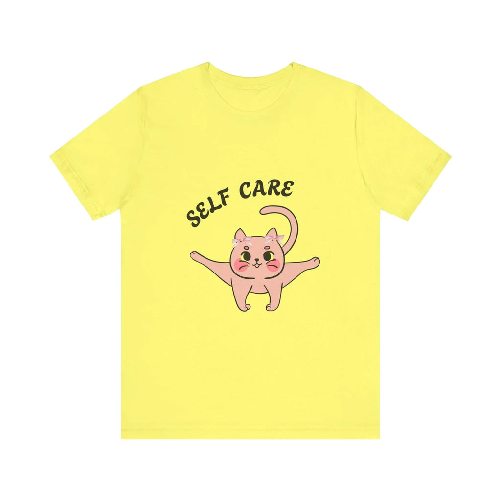 Yellow t-shirt with a pink cat illustration and 'SELF CARE' text on a white background