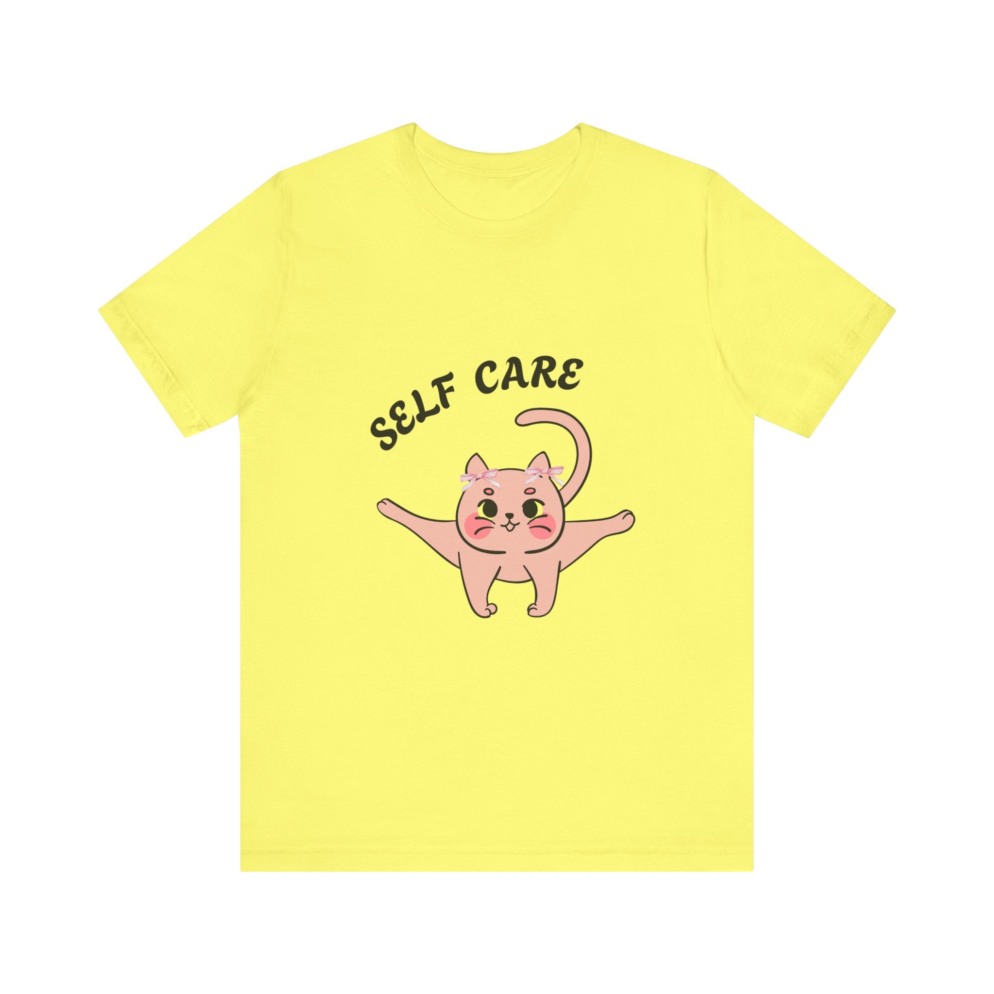 Yellow t-shirt with a pink cat illustration and 'SELF CARE' text on a white background