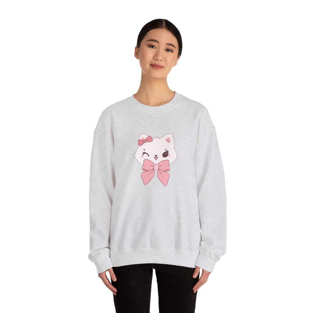 Person wearing a Ash sweatshirt with a cartoon cat face design on a white background