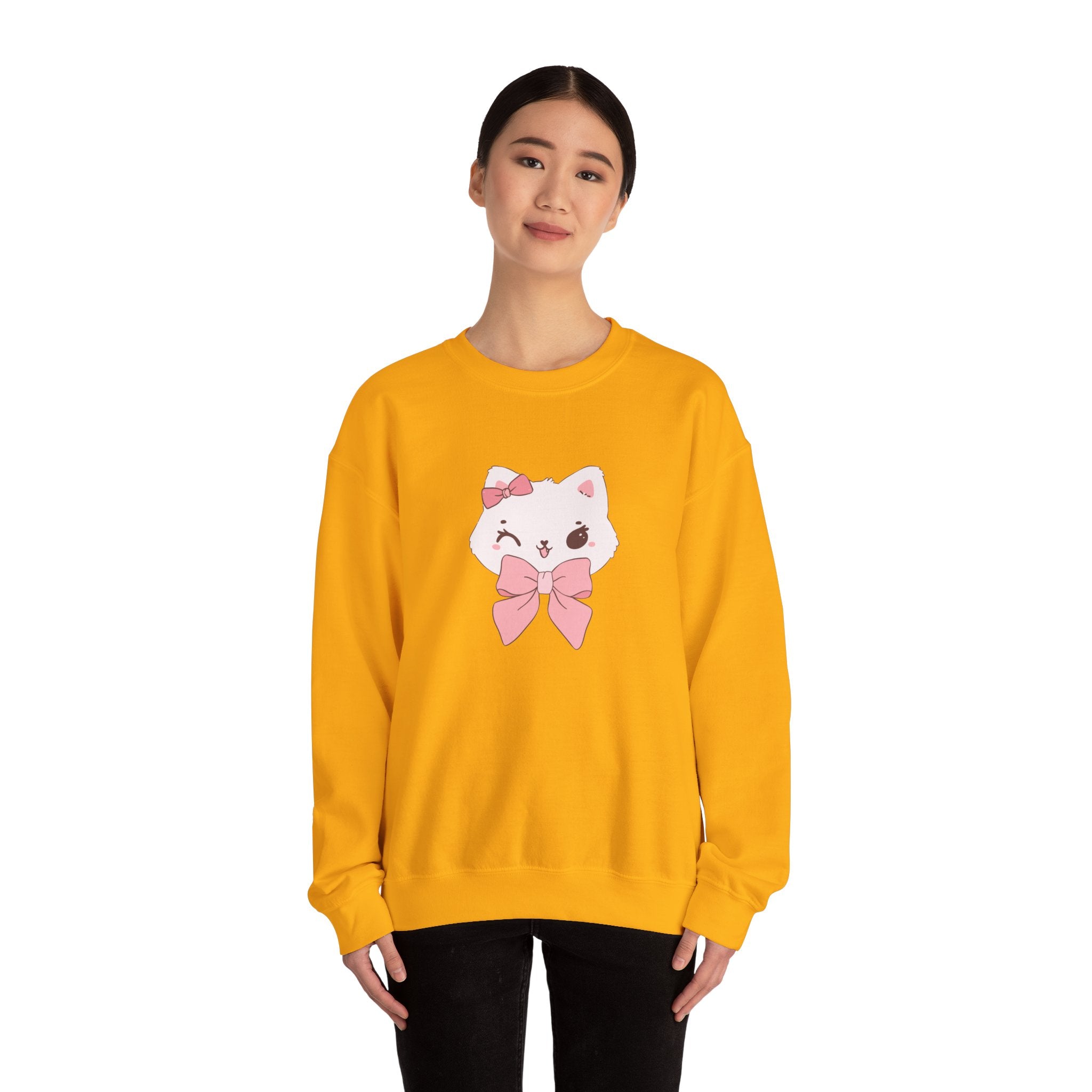 Person wearing a Gold sweatshirt with a cartoon cat design on a white background