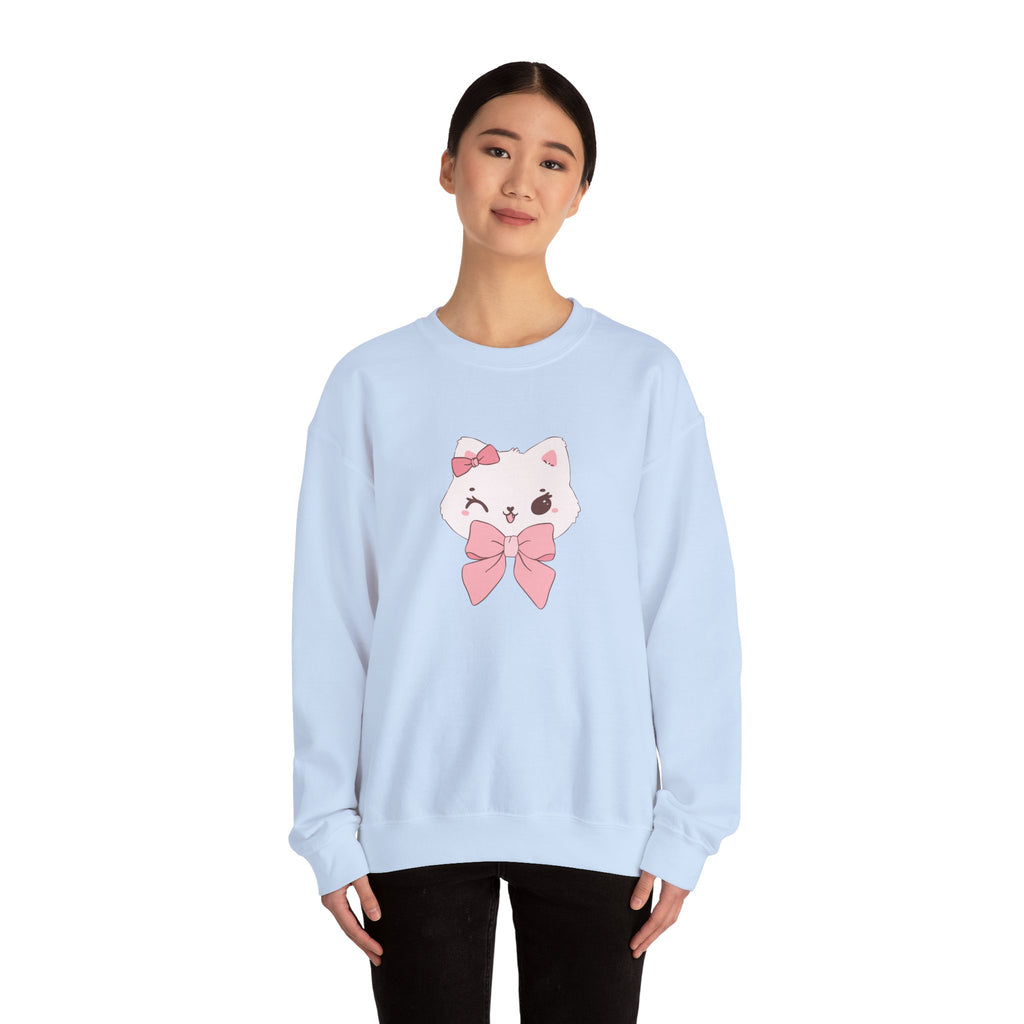 Light blue sweatshirt with a cartoon cat design featuring a pink bow worn by a person on a white background
