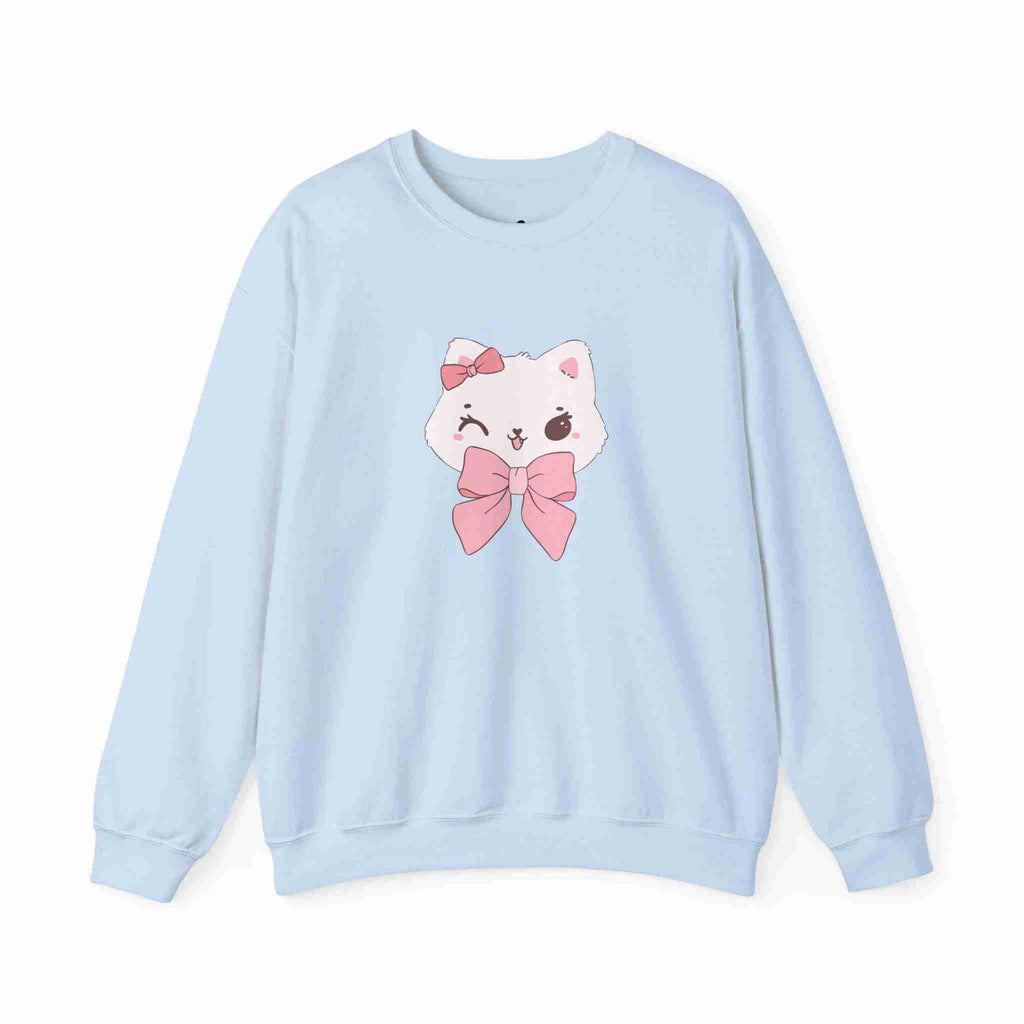 Light blue sweatshirt with a cartoon cat design featuring a pink bow on a white background