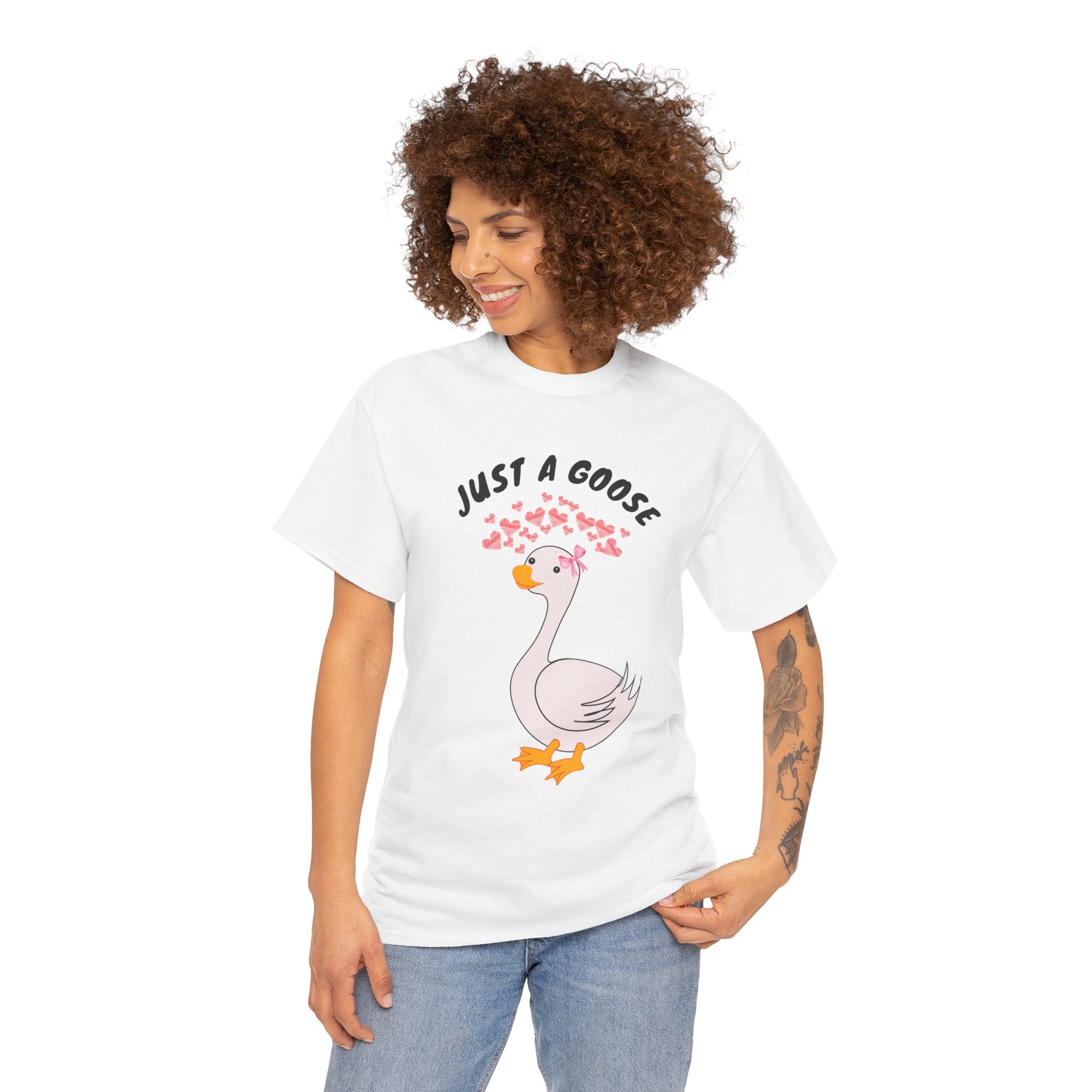 Woman wearing a white t-shirt with a cartoon goose and text on a white background