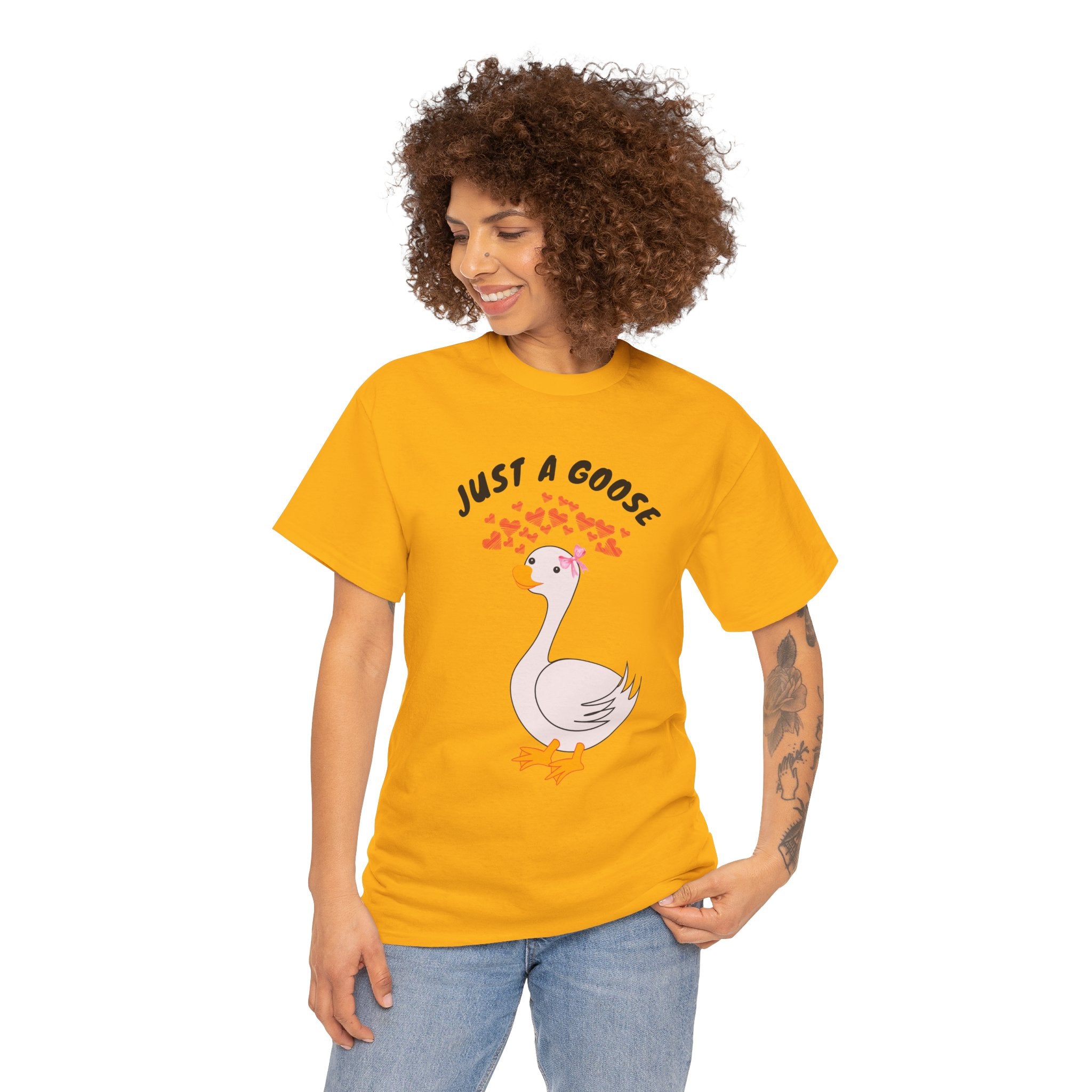 Woman wearing a Gold  t-shirt with a goose graphic and text on a white background