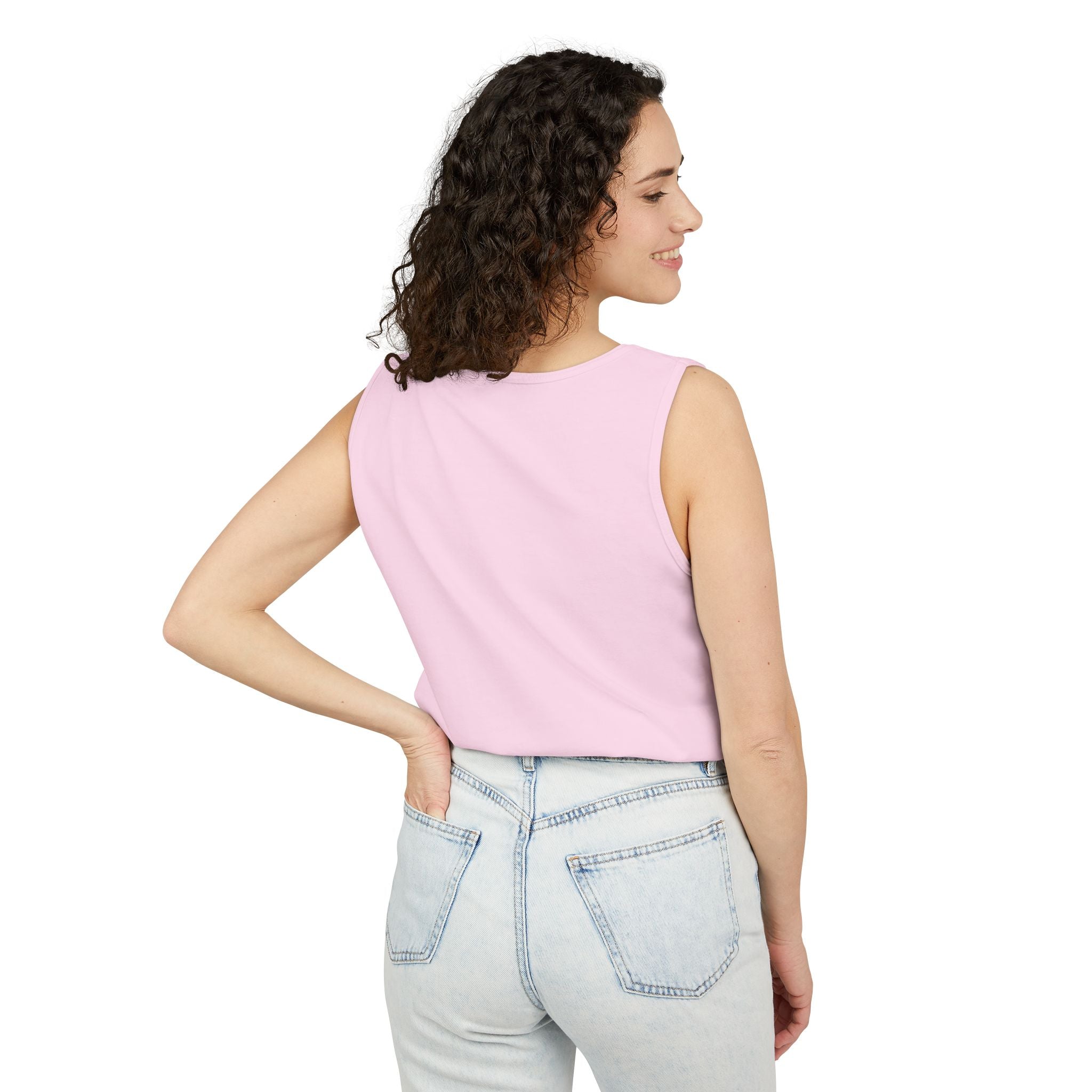 Woman wearing a Blossom sleeveless top and light blue jeans on a white background.
