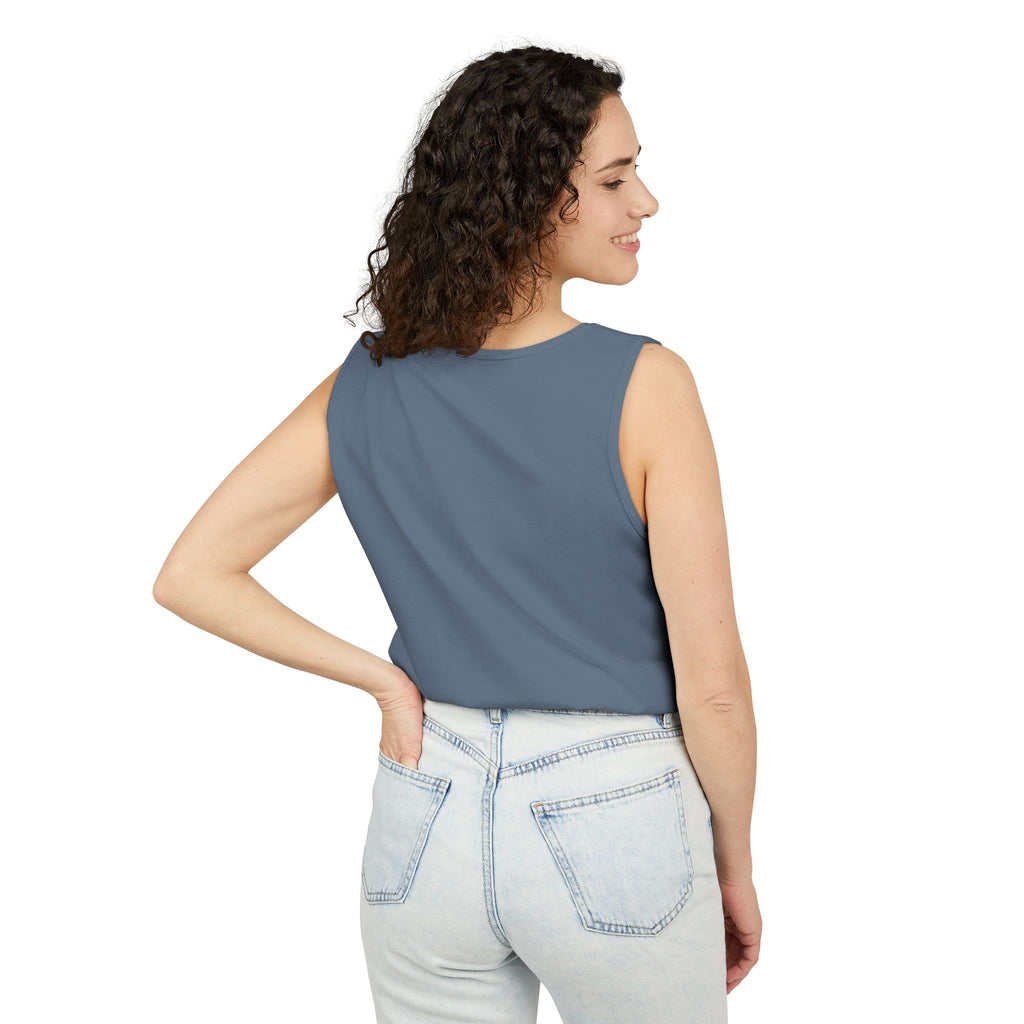 Woman wearing a sleeveless Blue Jean top and light blue jeans on a white background