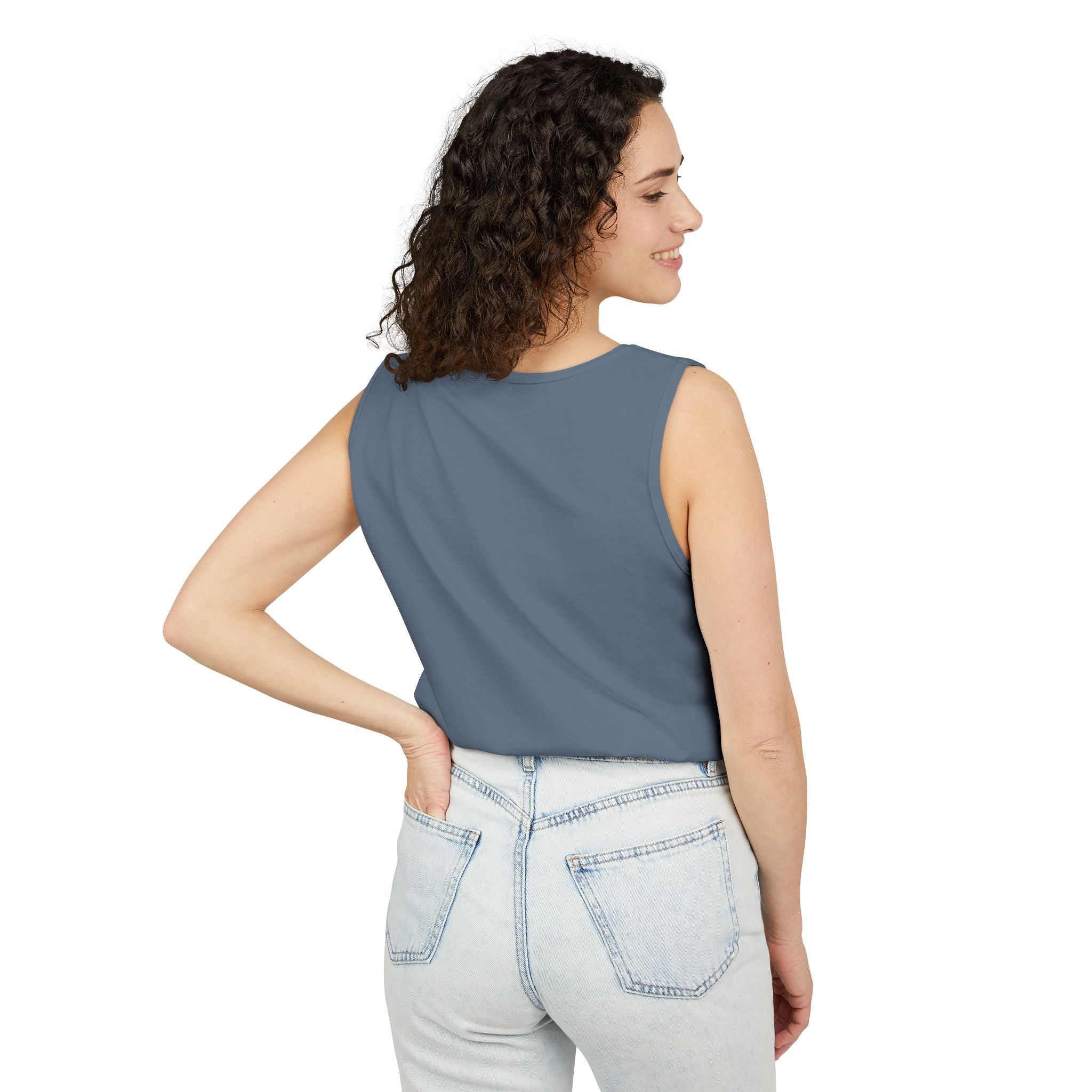 Woman wearing a sleeveless Blue Jean top and light blue jeans on a white background