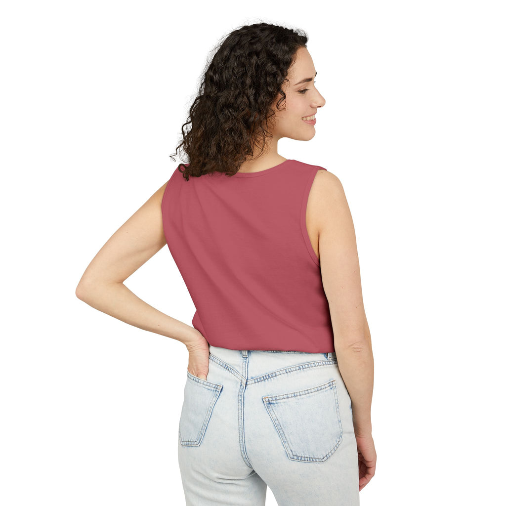 Woman wearing a sleeveless Crimson top and jeans on a white background