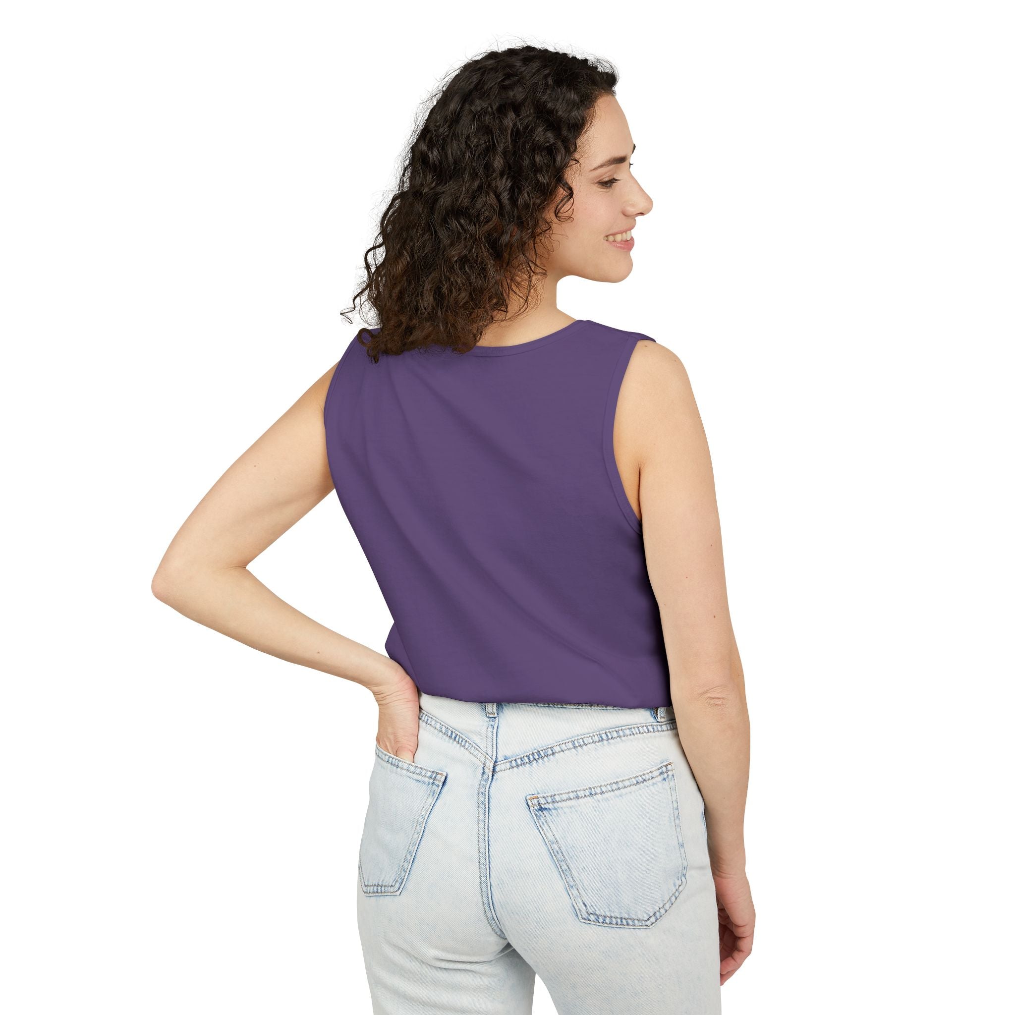 Woman wearing a Grape sleeveless top and light blue jeans on a white background