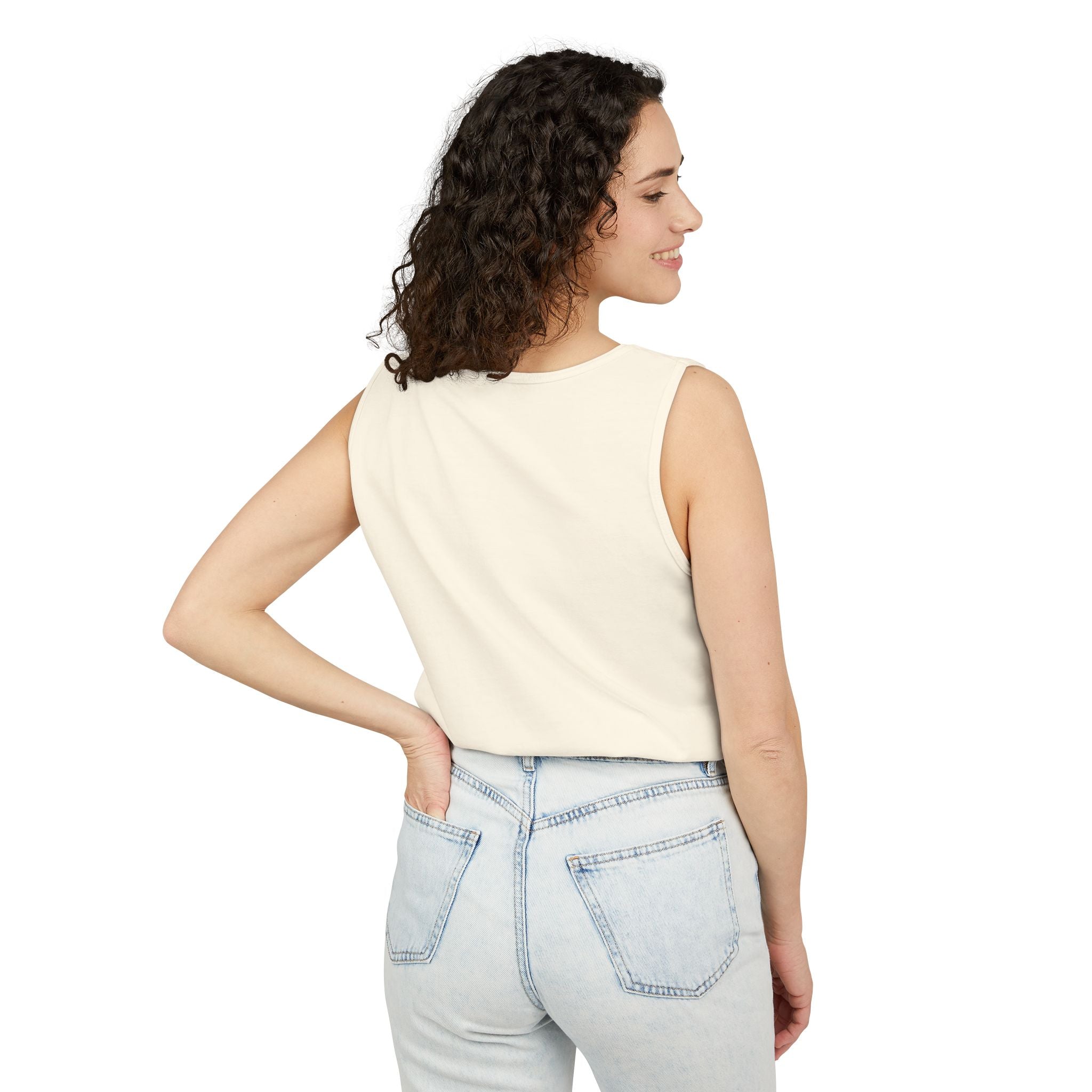 Woman wearing a Ivory sleeveless top and light blue jeans on a white background