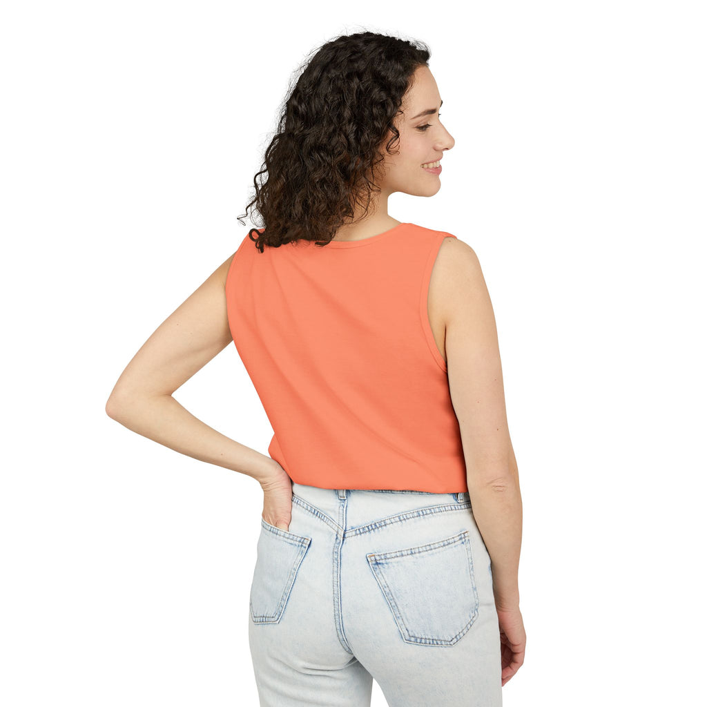 Woman wearing a Melon sleeveless top and light blue jeans on a white background