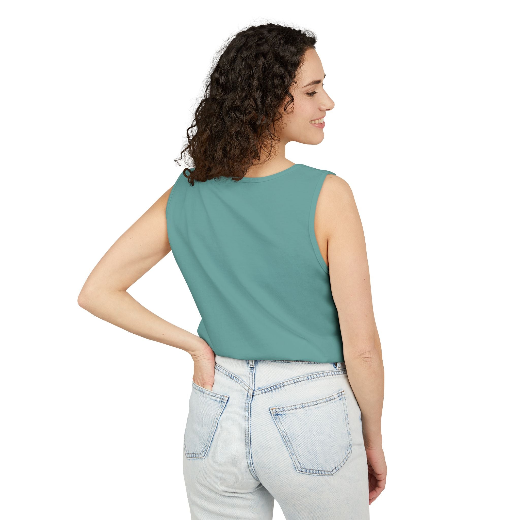 Woman wearing a Seafoam sleeveless top and light blue jeans on a white background