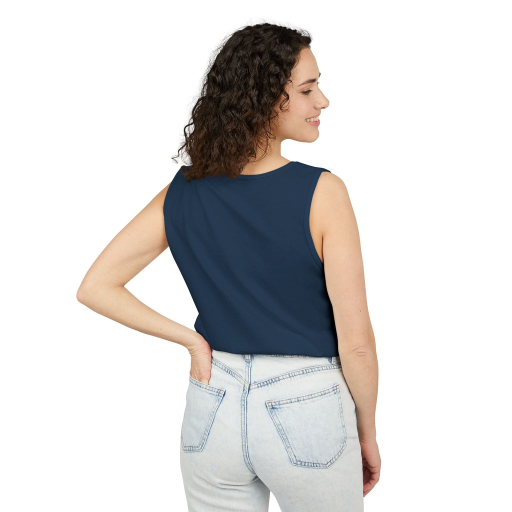 Woman wearing a True navy sleeveless top and light blue jeans on a white background