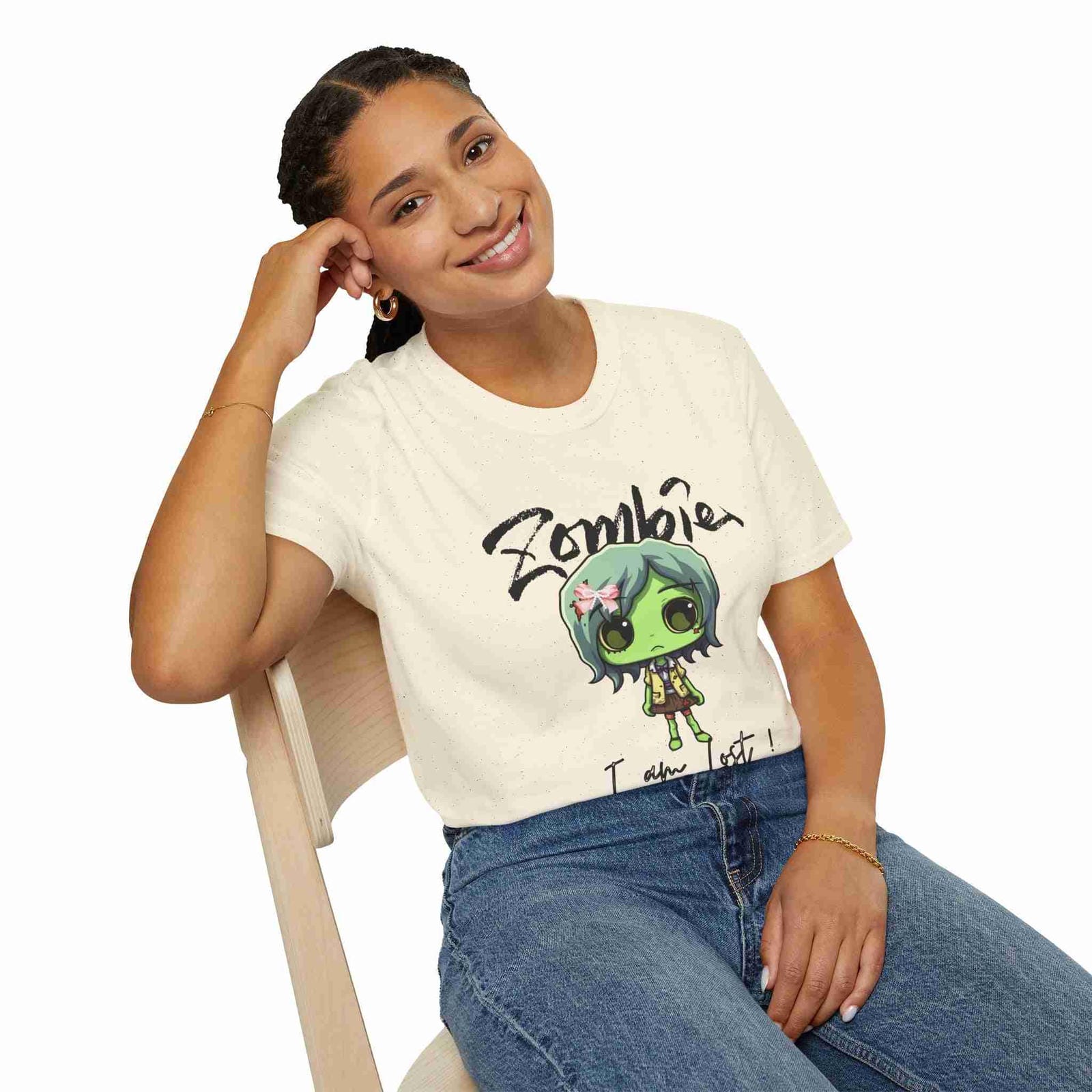 Person wearing a Natural t-shirt with a graphic design and text, sitting on a chair.