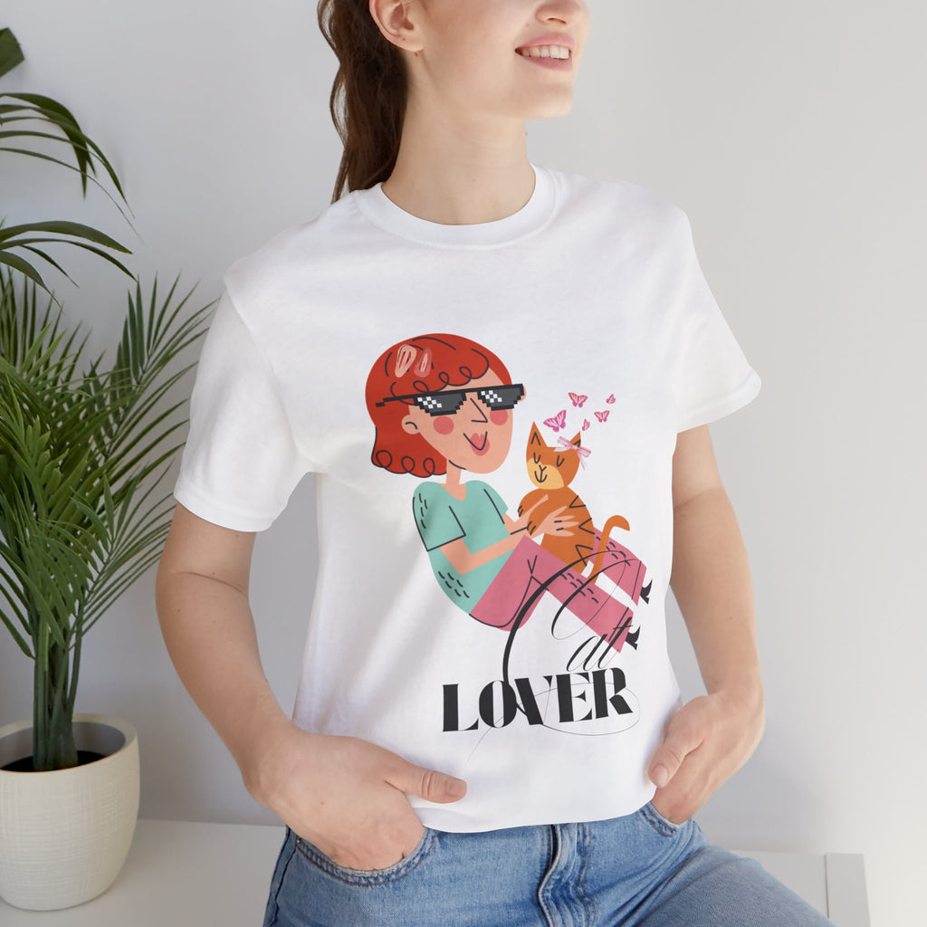 Person wearing a white t-shirt with a graphic design of a woman holding a cat and the word 'Cat LOVER'.