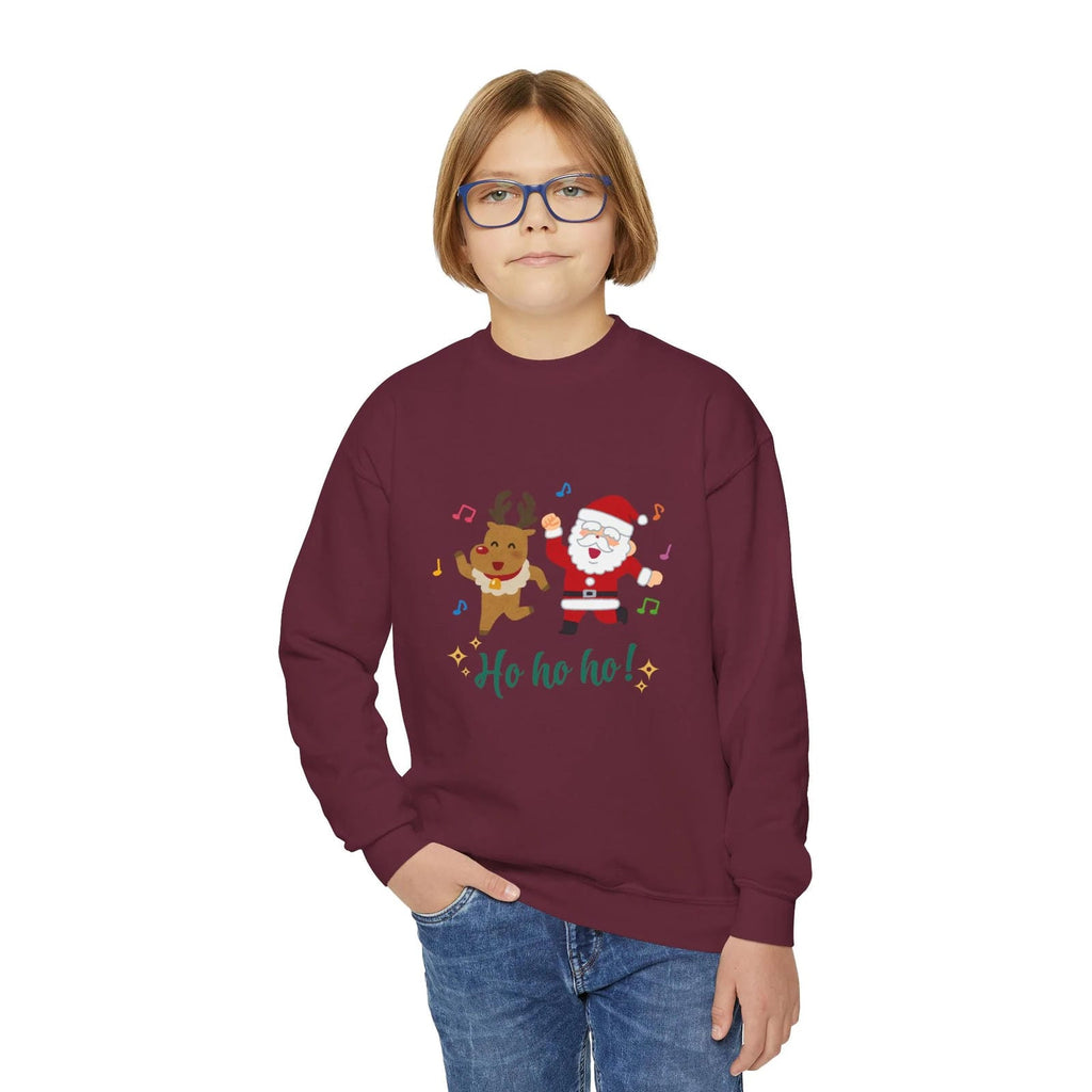 Child wearing a maroon sweatshirt with a Christmas design on a white background