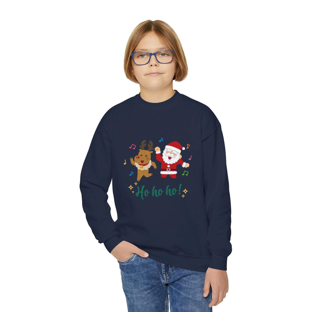 Child wearing a navy blue sweatshirt with Christmas design on a white background