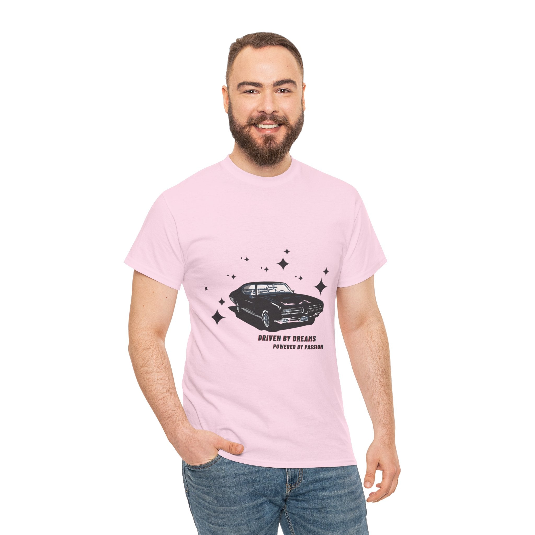 Man wearing a light pink t-shirt with a car graphic and text on a white background