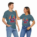 Two people wearing matching Heather deep teal t-shirts with a colorful graphic and text on a white background