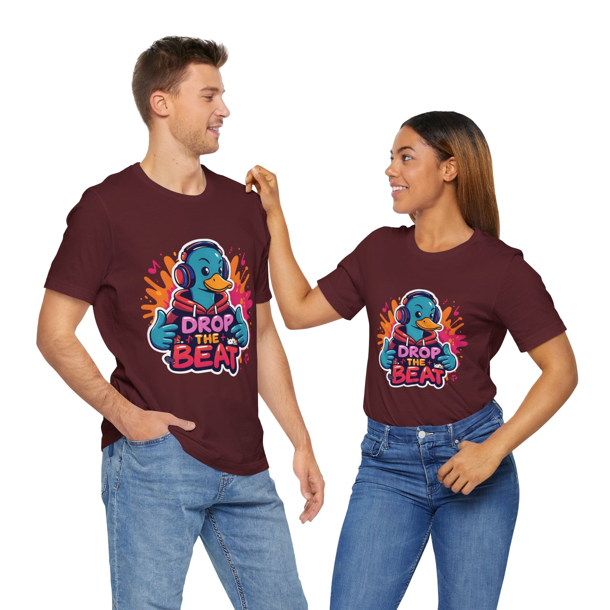 Two people wearing matching maroon t-shirts with a colorful graphic and text on a white background.