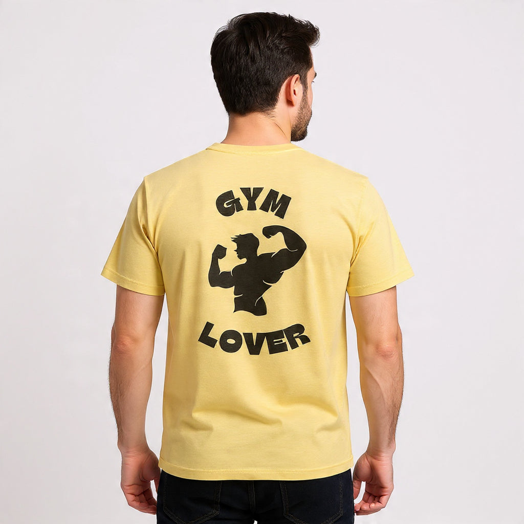 Man wearing a Solid Banana Cream t-shirt with 'GYM LOVER' text and graphic on the back against a plain background