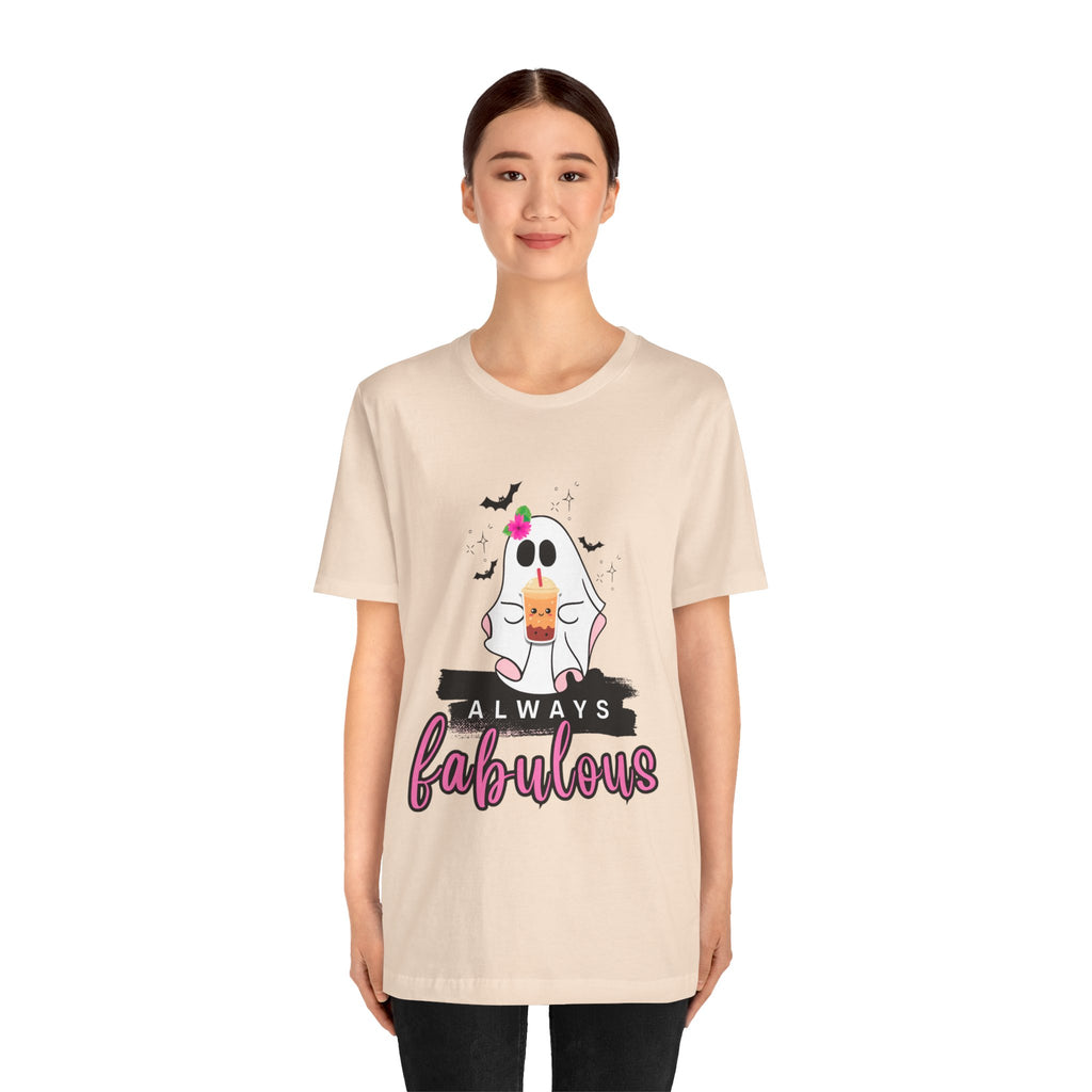 Person wearing a soft cream t-shirt with a ghost graphic and text on a white background