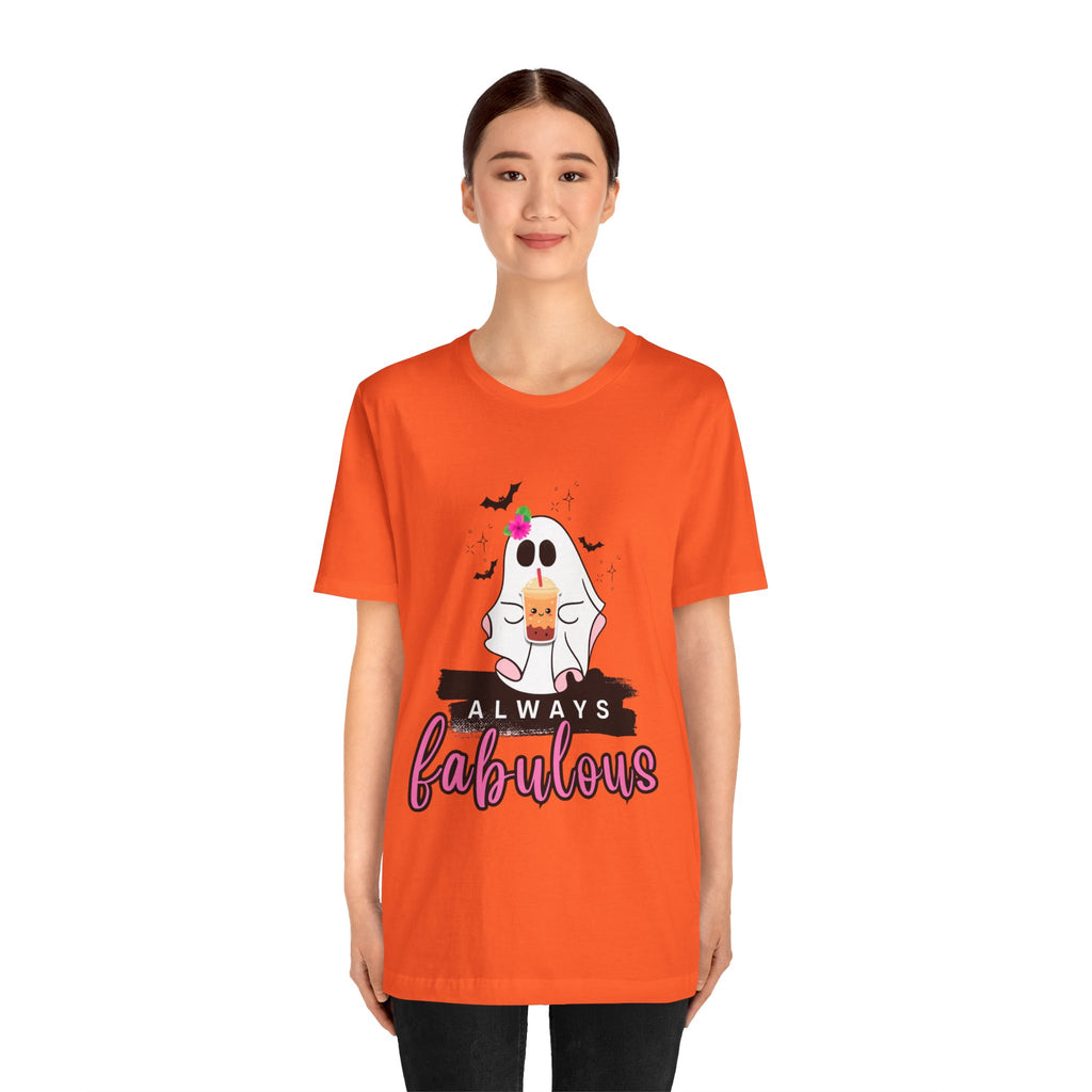 Person wearing an orange t-shirt with a ghost graphic and 'Always fabulous' text on a white background