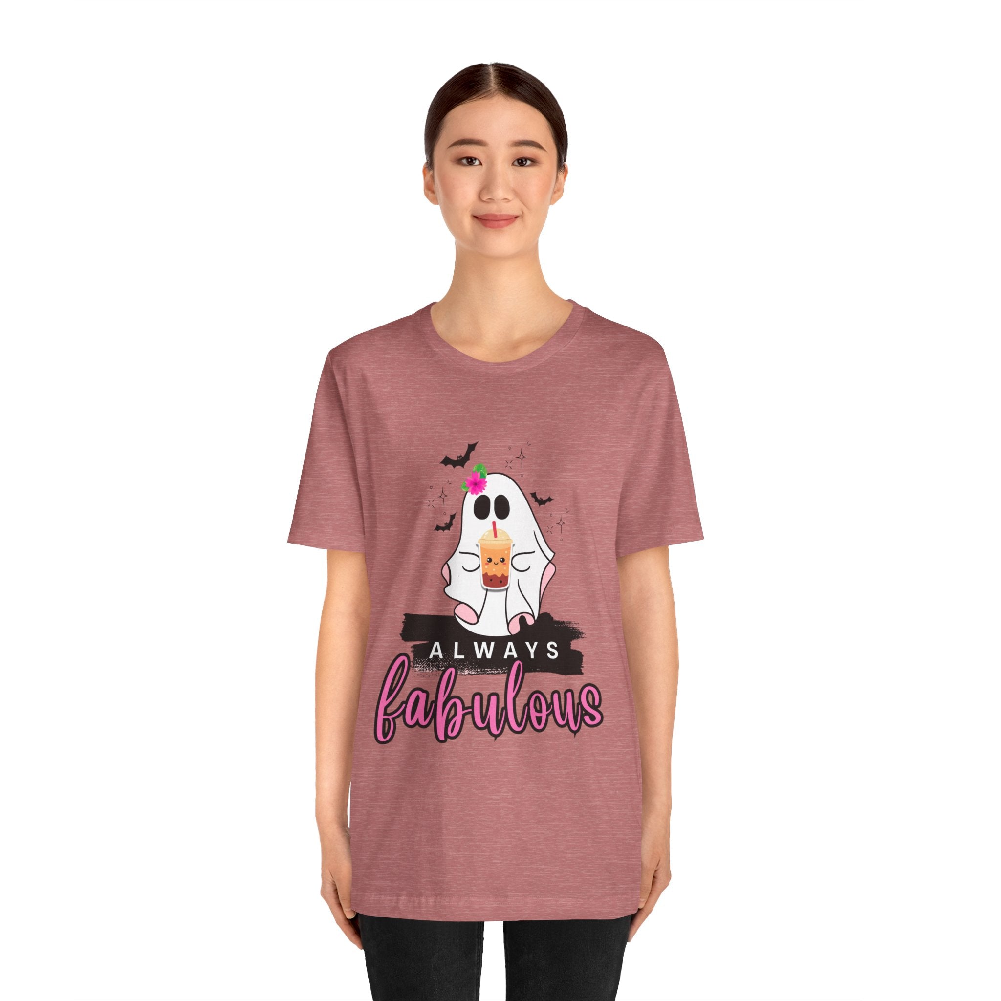 Person wearing a Heather mauve t-shirt with a ghost and ice cream graphic and 'Always fabulous' text.