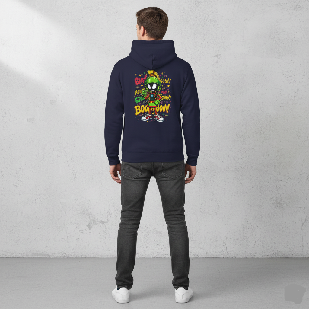 Person wearing a Oxford navy hoodie with colorful graphics on the back against a gray concrete wall.