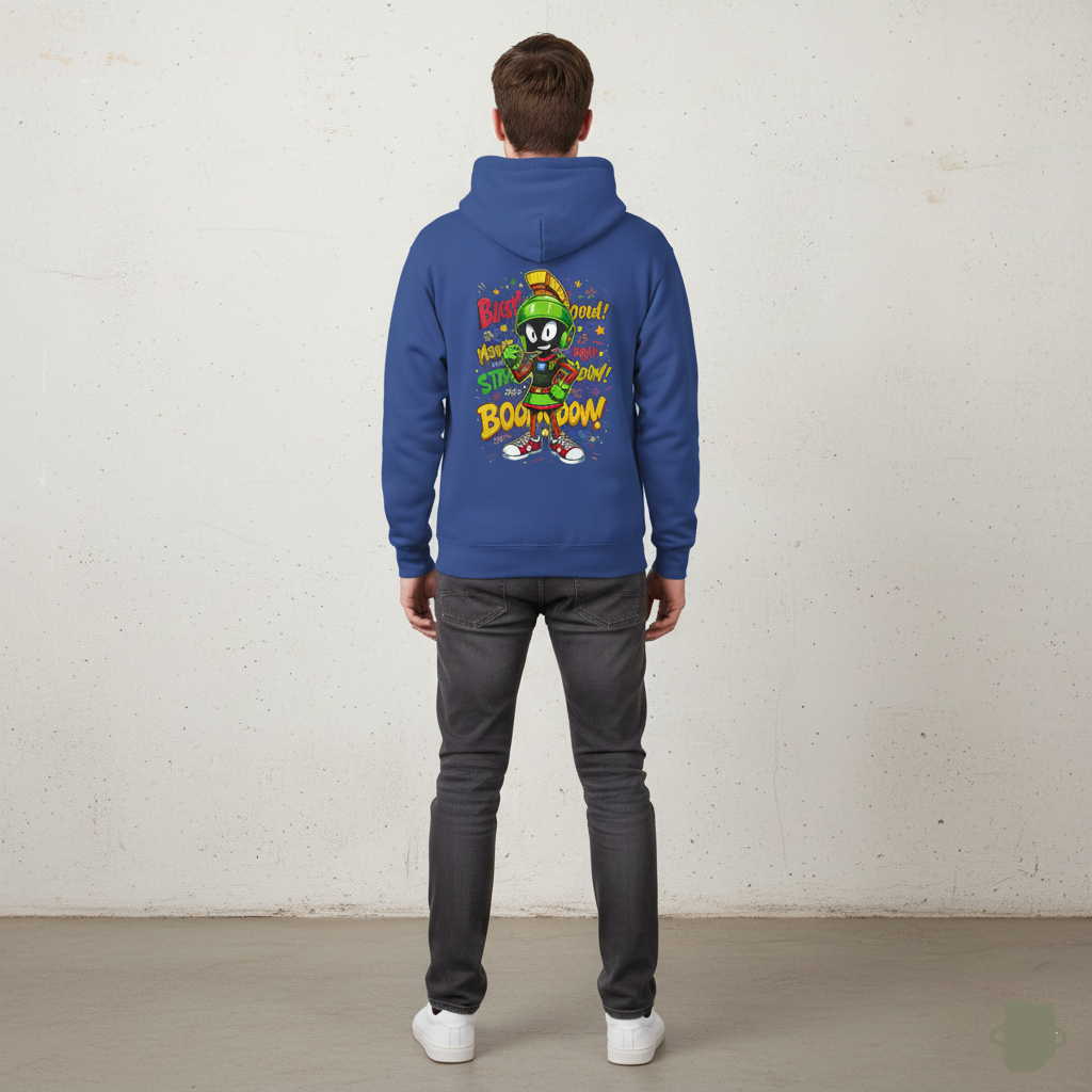 Person wearing a Royal blue hoodie with a colorful graphic on the back against a white wall.