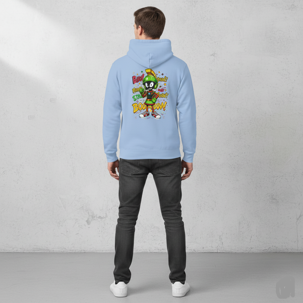 Person wearing a Sky blue hoodie with a colorful graphic on the back, standing against a gray concrete wall.