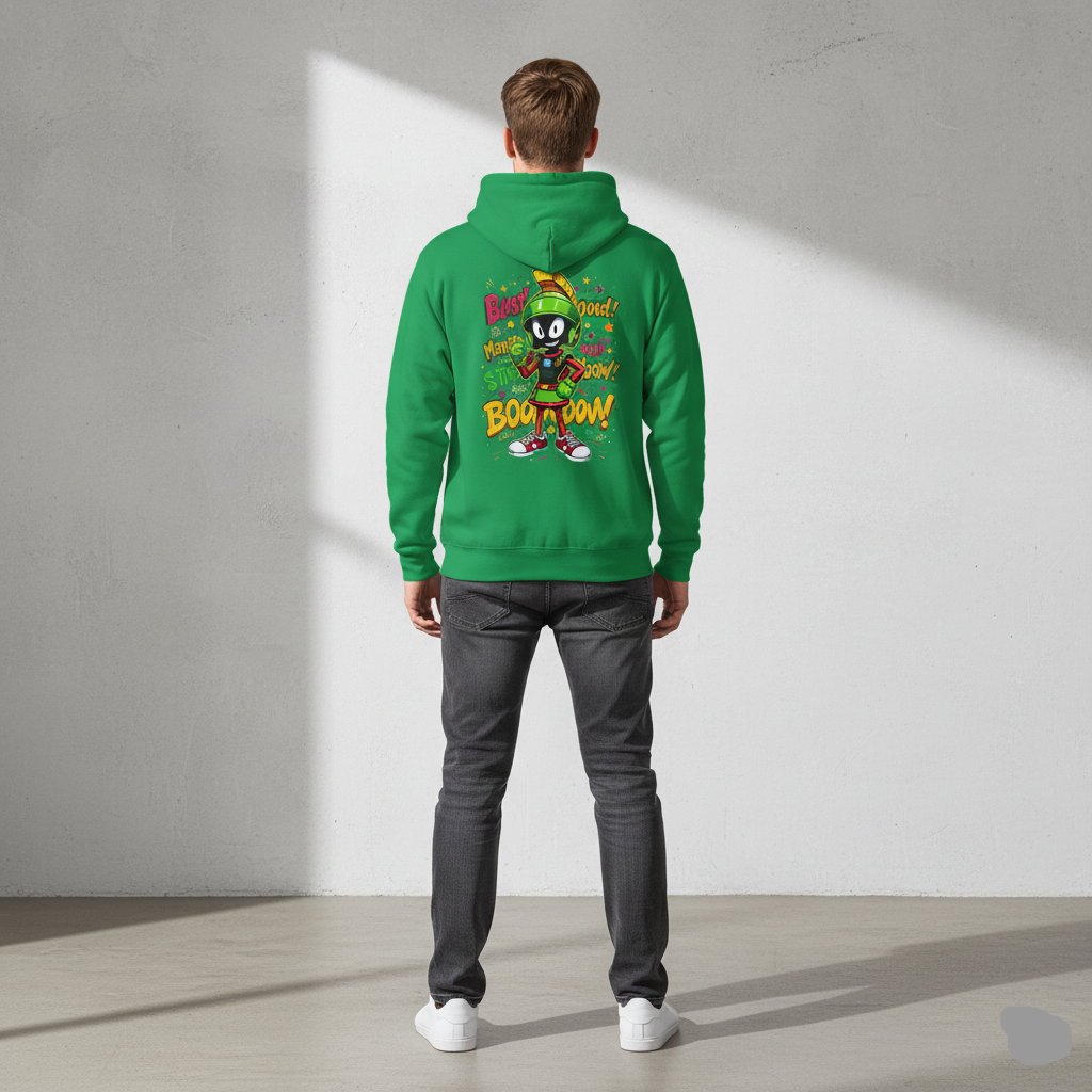 Person wearing a Kelly green hoodie with a colorful graphic on the back against a plain background