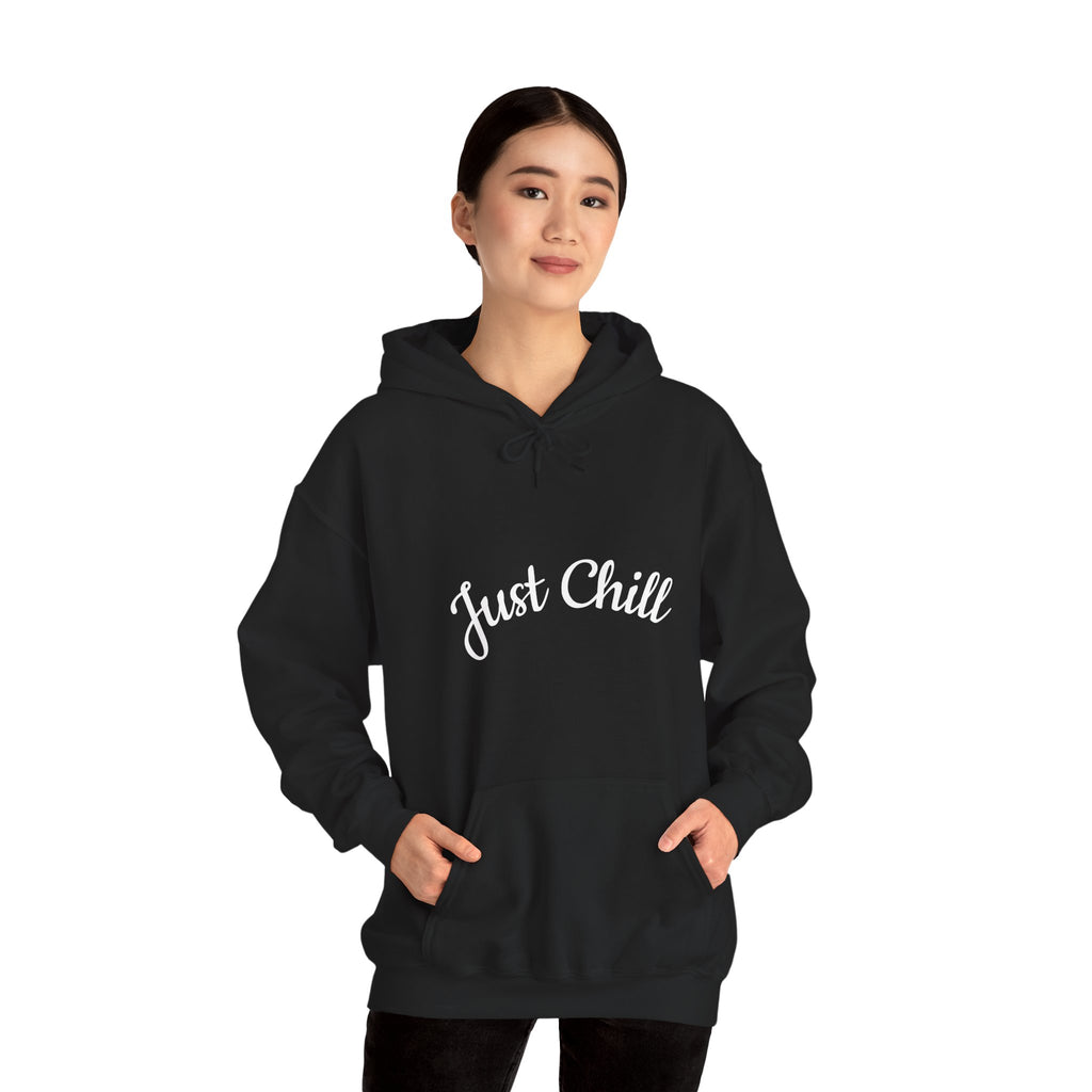 Person wearing a black hoodie with 'Just Chill' text on a white background