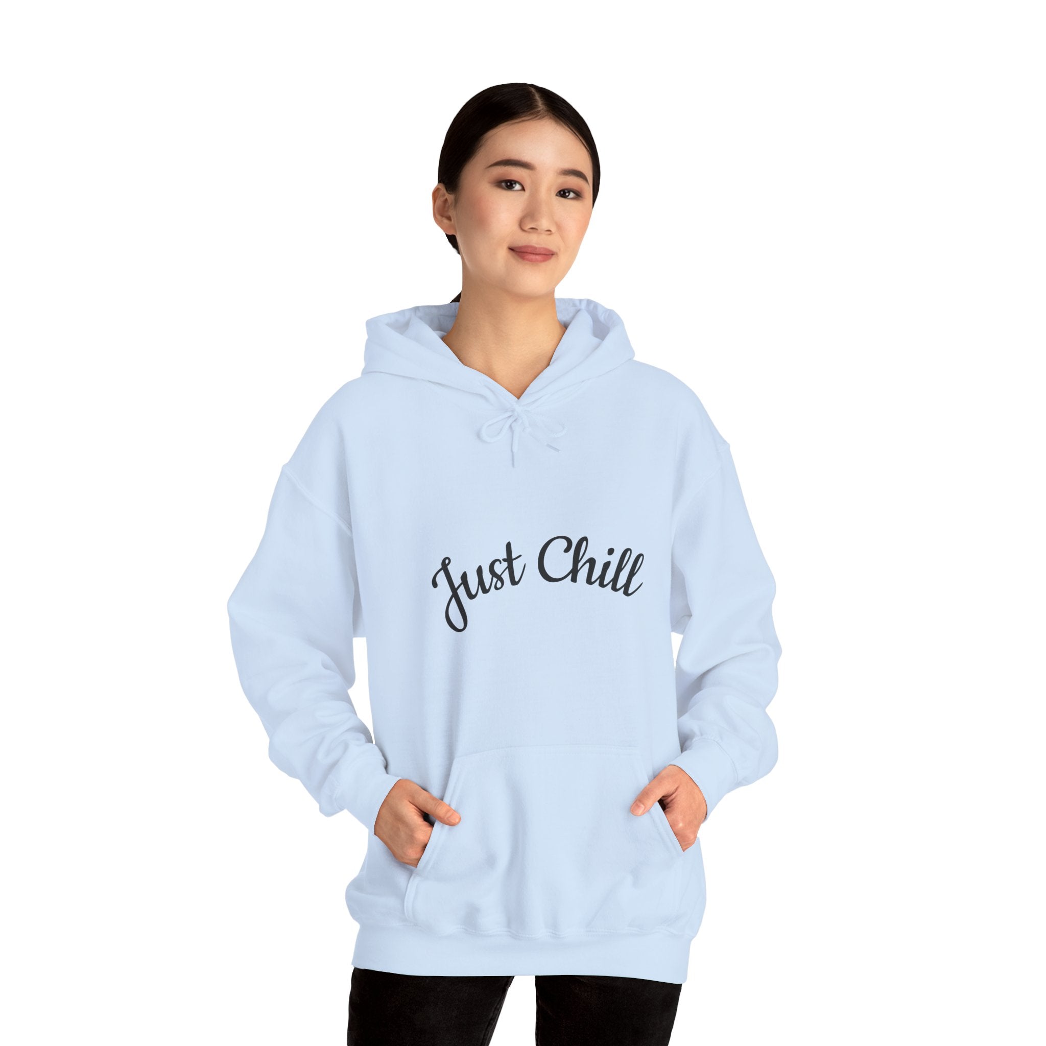 Light blue hoodie with 'Just Chill' text worn by a person on a white background