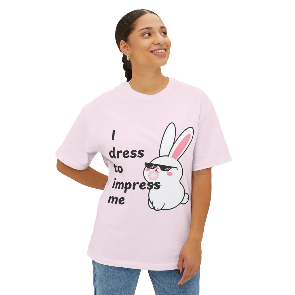 Person wearing a Soft pink t-shirt with a cartoon bunny and text on a white background