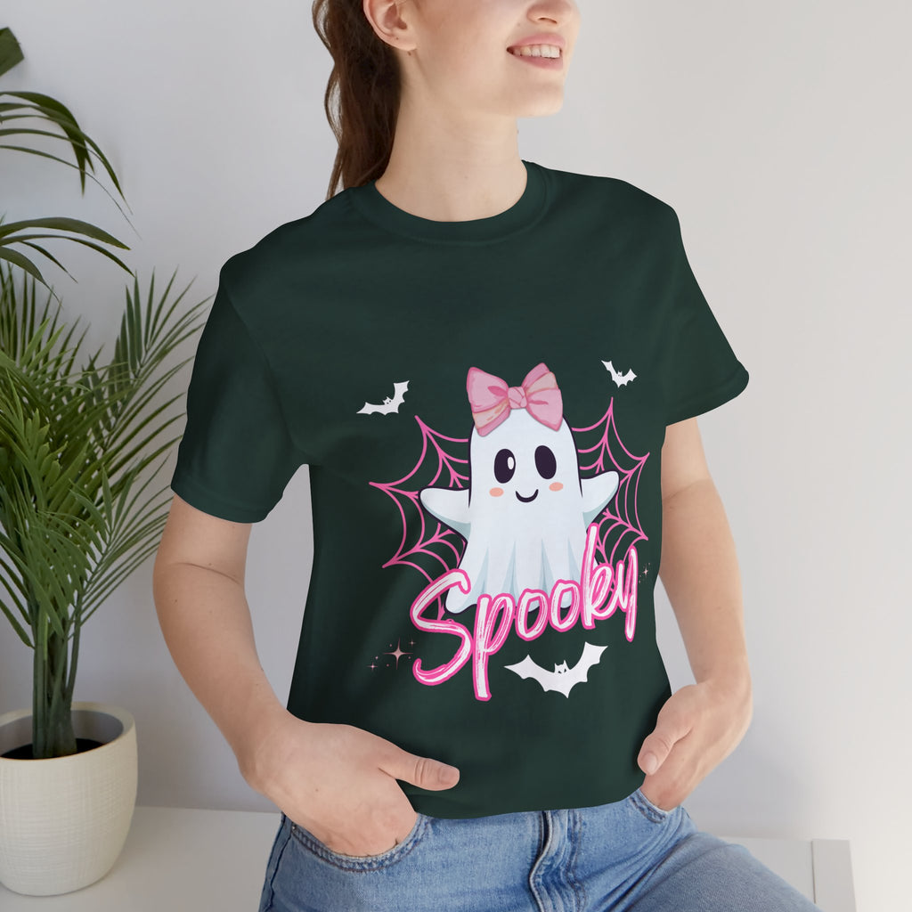 Person wearing a forest t-shirt with a ghost design and 'Spooky' text, standing indoors.